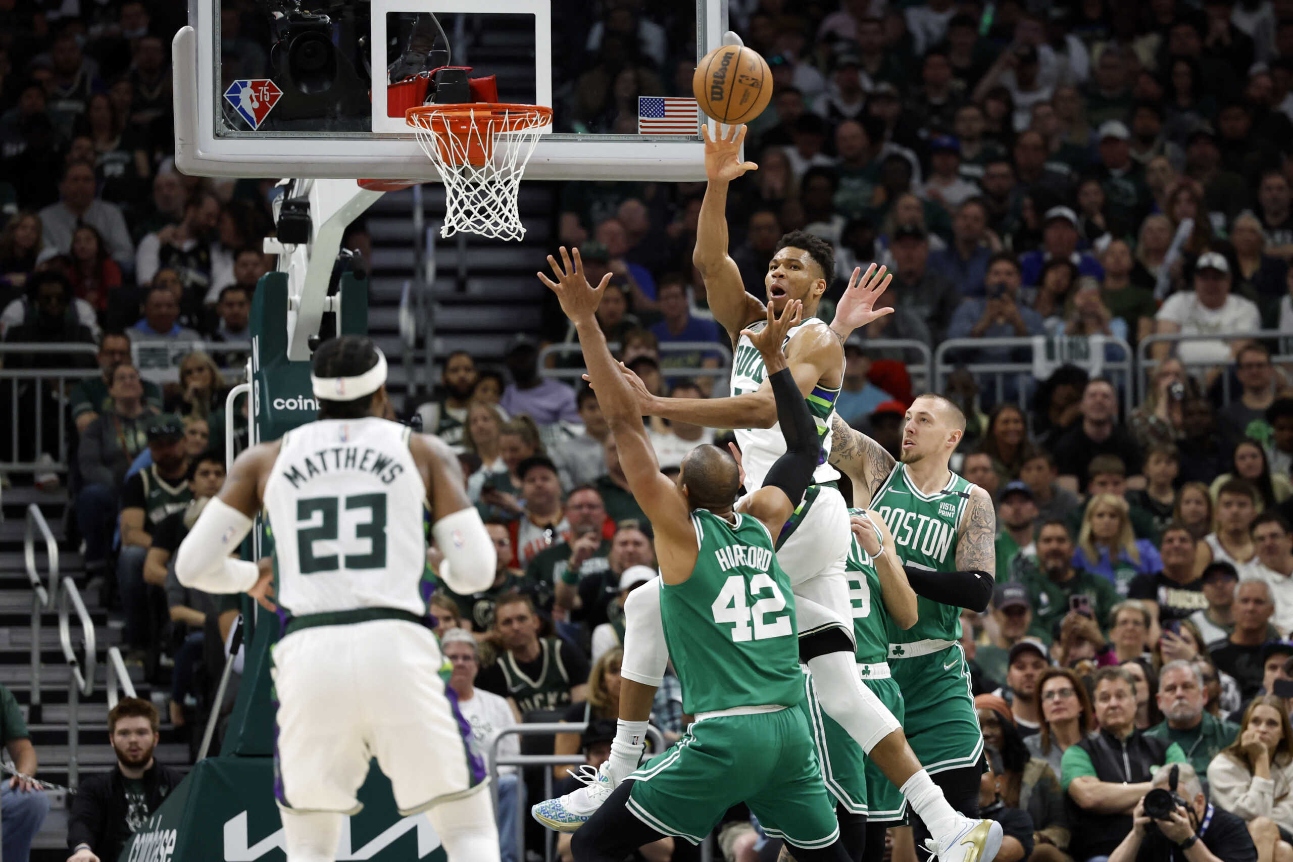 May 7, 2022; Milwaukee, Wisconsin, USA; Milwaukee Bucks forward Giannis Antetokounmpo (34) passes the ball to guard Wesley Matthews (23) during the third quarter against the Boston Celtics during game three of the second round for the 2022 NBA playoffs at Fiserv Forum. Mandatory Credit: Jeff Hanisch-USA TODAY Sports