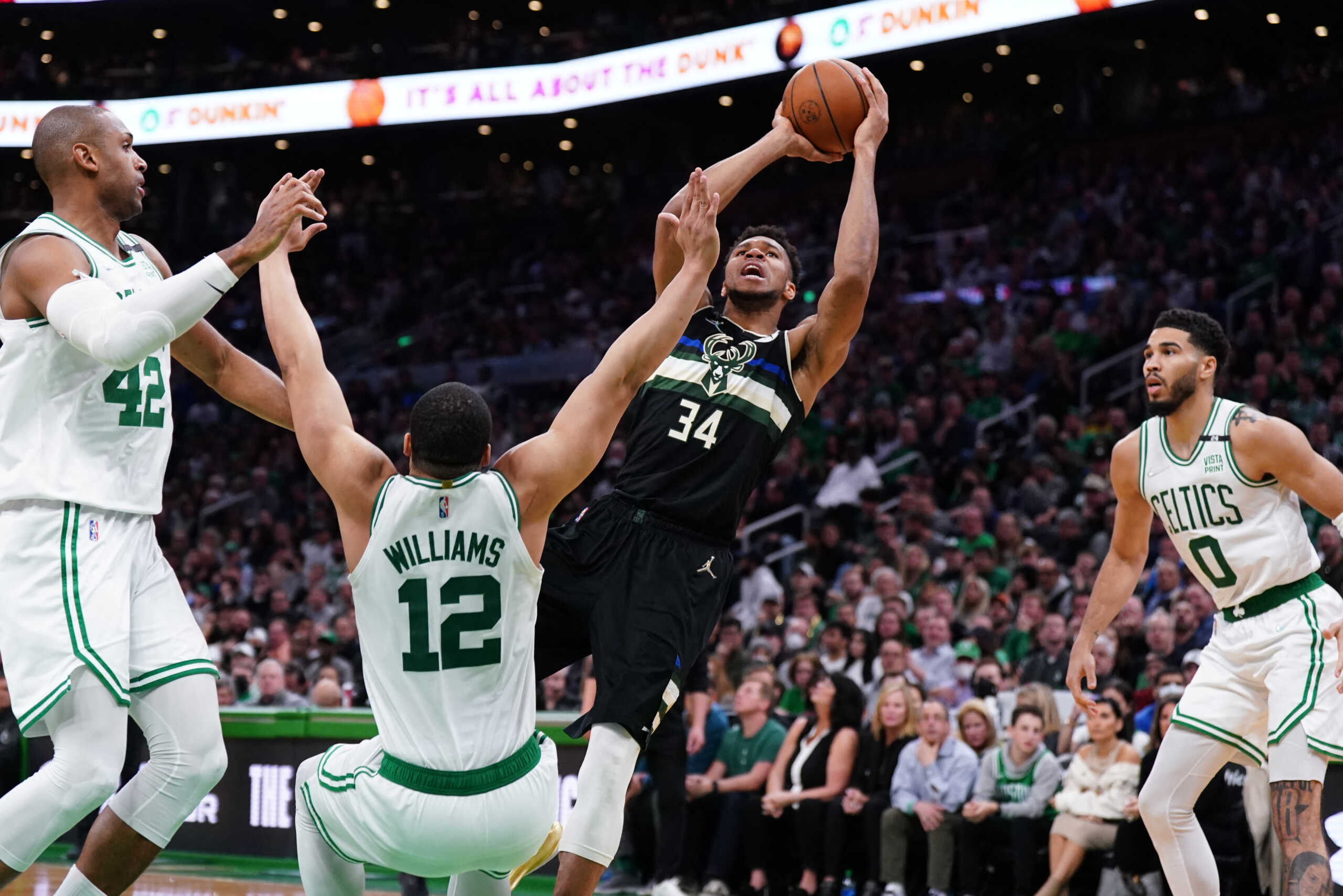 May 11, 2022; Boston, Massachusetts, USA; Milwaukee Bucks forward Giannis Antetokounmpo (34) shoots against Boston Celtics forward Jayson Tatum (0) in the second half during game five of the second round for the 2022 NBA playoffs at TD Garden. Mandatory Credit: David Butler II-USA TODAY Sports