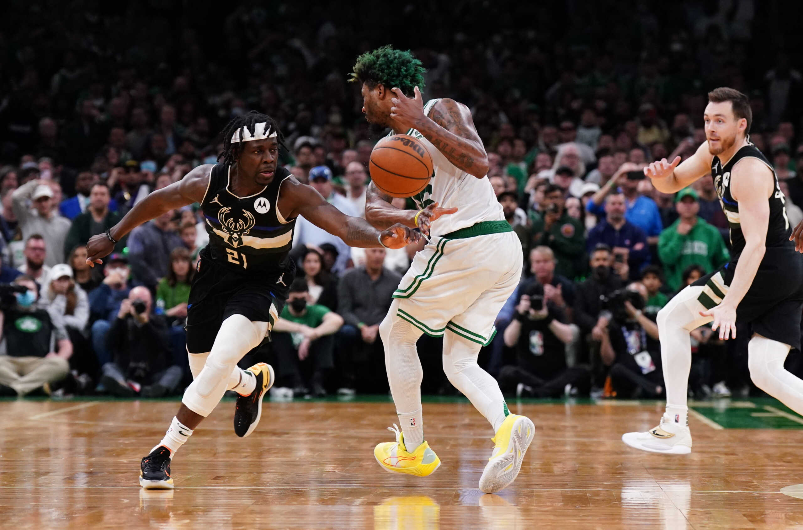 May 11, 2022; Boston, Massachusetts, USA; Milwaukee Bucks guard Jrue Holiday (21) steals the ball from Boston Celtics guard Marcus Smart (36) to end the game in the second half during game five of the second round for the 2022 NBA playoffs at TD Garden. Mandatory Credit: David Butler II-USA TODAY Sports