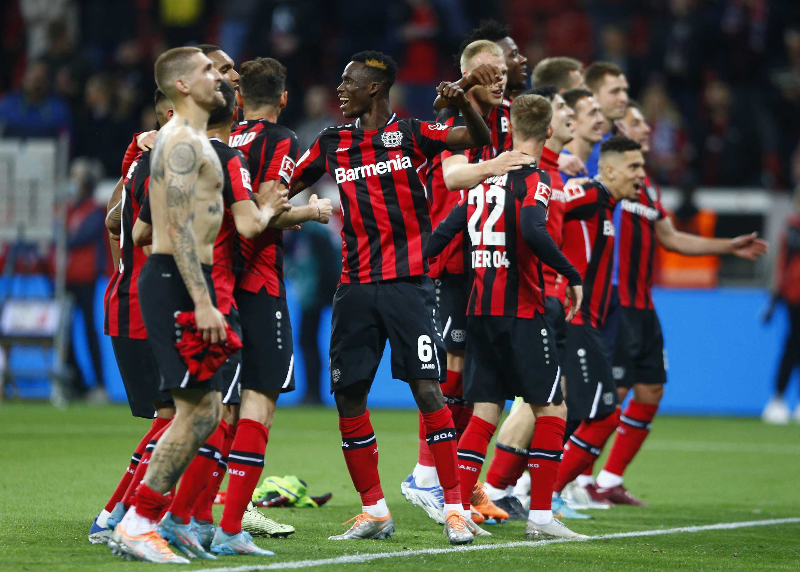 Soccer Football - Bundesliga - Bayer Leverkusen v Eintracht Frankfurt - BayArena, Leverkusen, Germany - May 2, 2022 Bayer Leverkusen's Odilon Kossounou with teammates celebrate after the match REUTERS