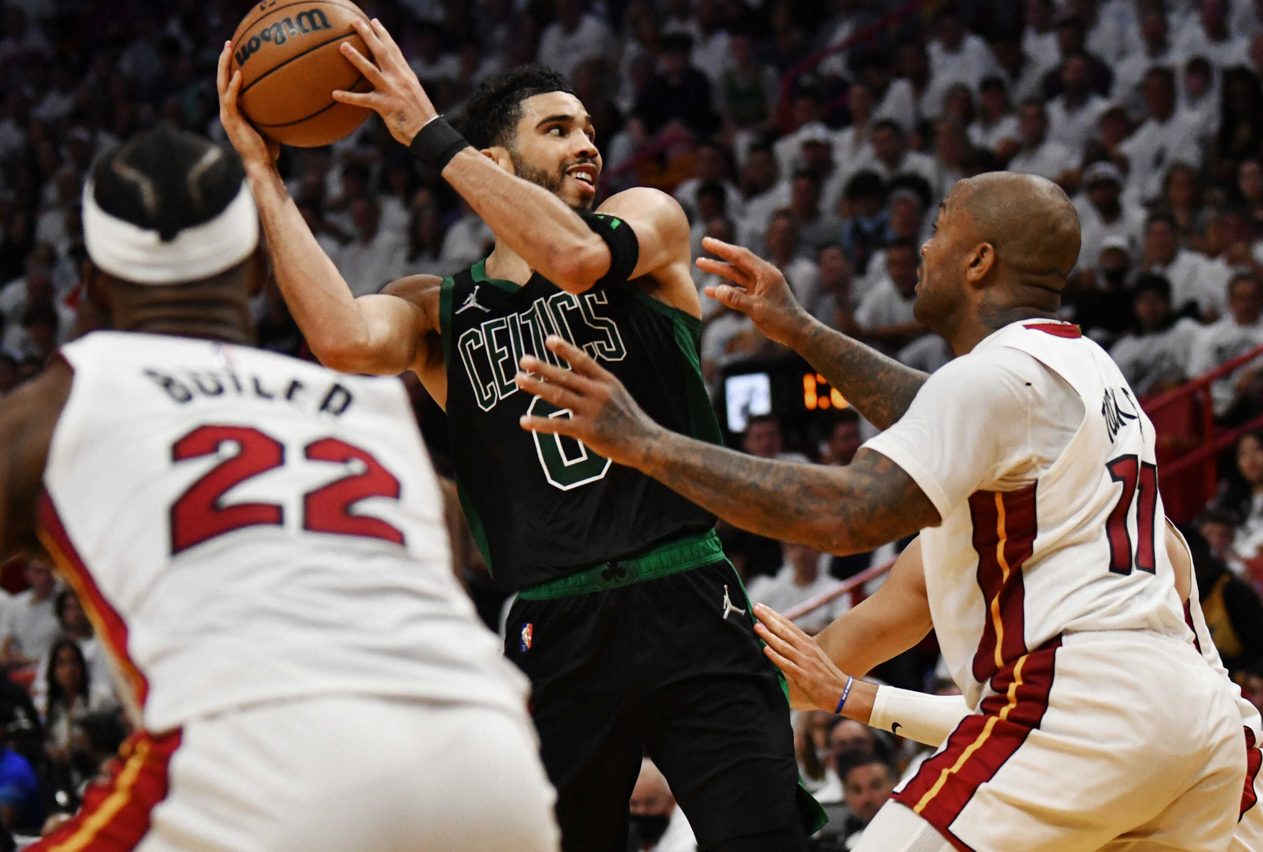 May 25, 2022; Miami, Florida, USA; Miami Heat forward P.J. Tucker (17) defends Boston Celtics forward Jayson Tatum (0) during the first half of game five of the 2022 eastern conference finals at FTX Arena. Mandatory Credit: Jim Rassol-USA TODAY Sports