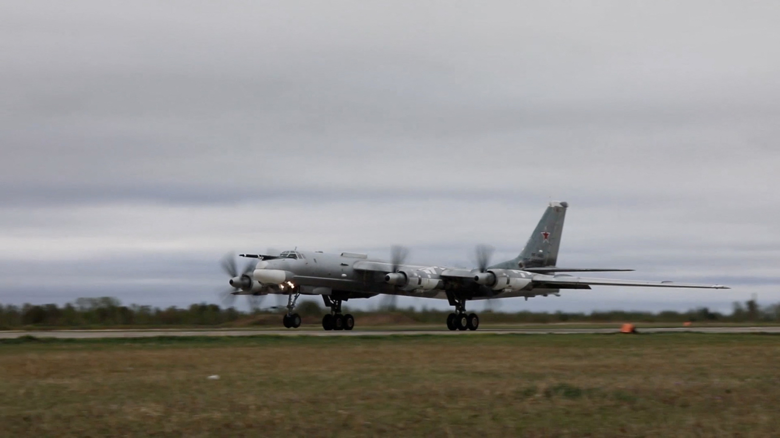 Russian Tu-95 strategic bomber takes off during Russian-Chinese military aerial exercises to patrol the Asia-Pacific region, at an unidentified location, in this still image taken from a video released May 24, 2022. Russian Defence Ministry