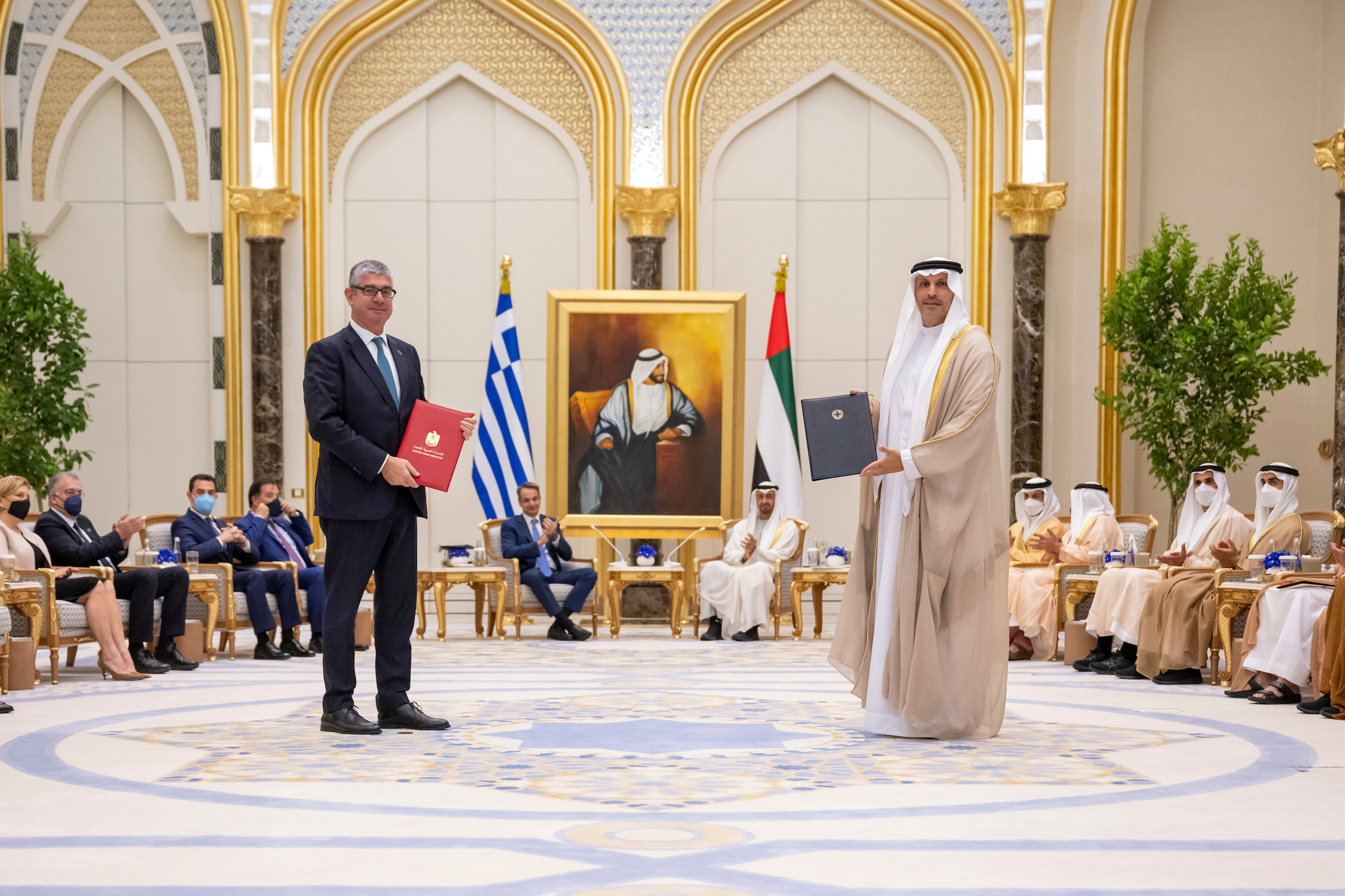 ABU DHABI, UNITED ARAB EMIRATES - May 09, 2022: HH Sheikh Mohamed bin Zayed Al Nahyan, Crown Prince of Abu Dhabi and Deputy Supreme Commander of the UAE Armed Forces (back center R) and HE Kyriakos Mitsotakis, Prime Minister of Greece (back center L), witness an MOU exchange ceremony, during an official visit reception, at Qasr Al Watan. Seen exchanging HE Khaldoon Khalifa Al Mubarak, Abu Dhabi Executive Council Member Chairman of the Executive Affairs Authority and Managing Director Group CEO of Mubadala Investment Company (front R).

( Hamad Al Kaabi 
---