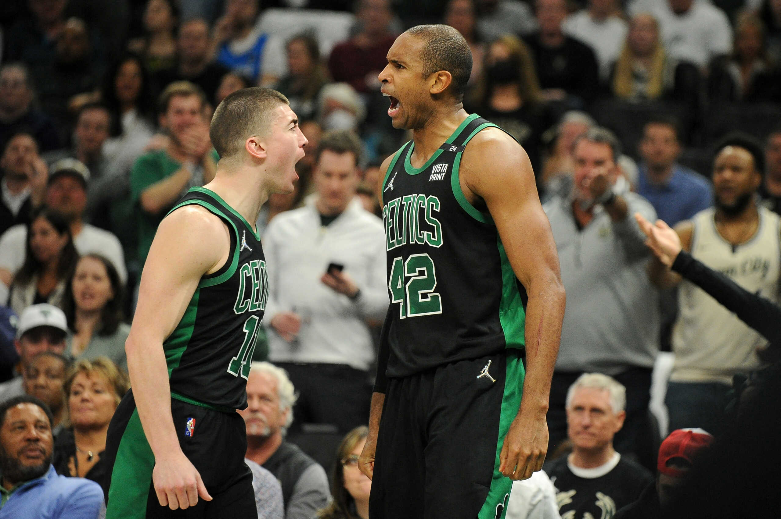 May 9, 2022; Milwaukee, Wisconsin, USA; Boston Celtics center Al Horford (42), right yells out after being fouled along with Boston Celtics guard Payton Pritchard (11) in the second half during game four of the second round for the 2022 NBA playoffs at Fiserv Forum. Mandatory Credit: Michael McLoone-USA TODAY Sports
