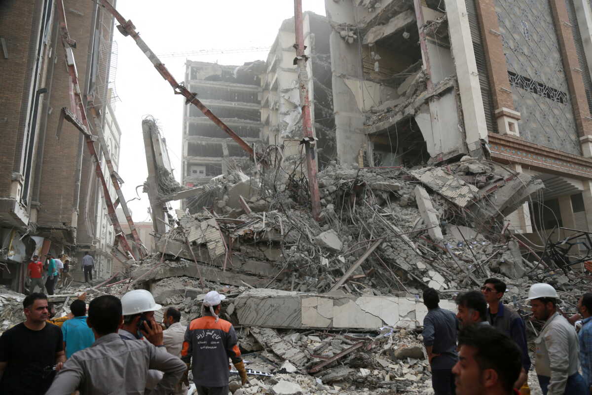 FILE PHOTO: Rescue crews work at the site of a ten-storey building collapse in Abadan, Iran May 23, 2022. WANA (West Asia News Agency) via REUTERS ATTENTION EDITORS - THIS IMAGE HAS BEEN SUPPLIED BY A THIRD PARTY.