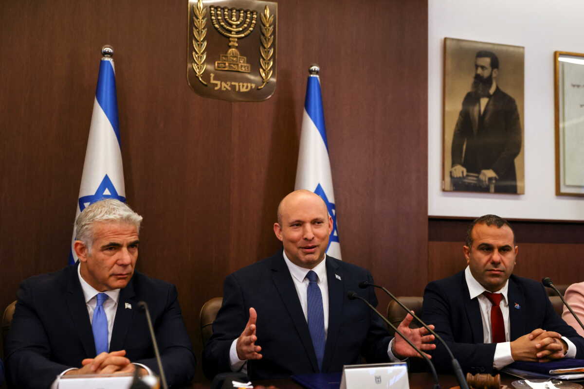 Israeli Prime Minister Naftali Bennett and Israeli Foreign Minister Yair Lapid attend a cabinet meeting at the Prime Minister's office in Jerusalem May 22, 2022. REUTERS