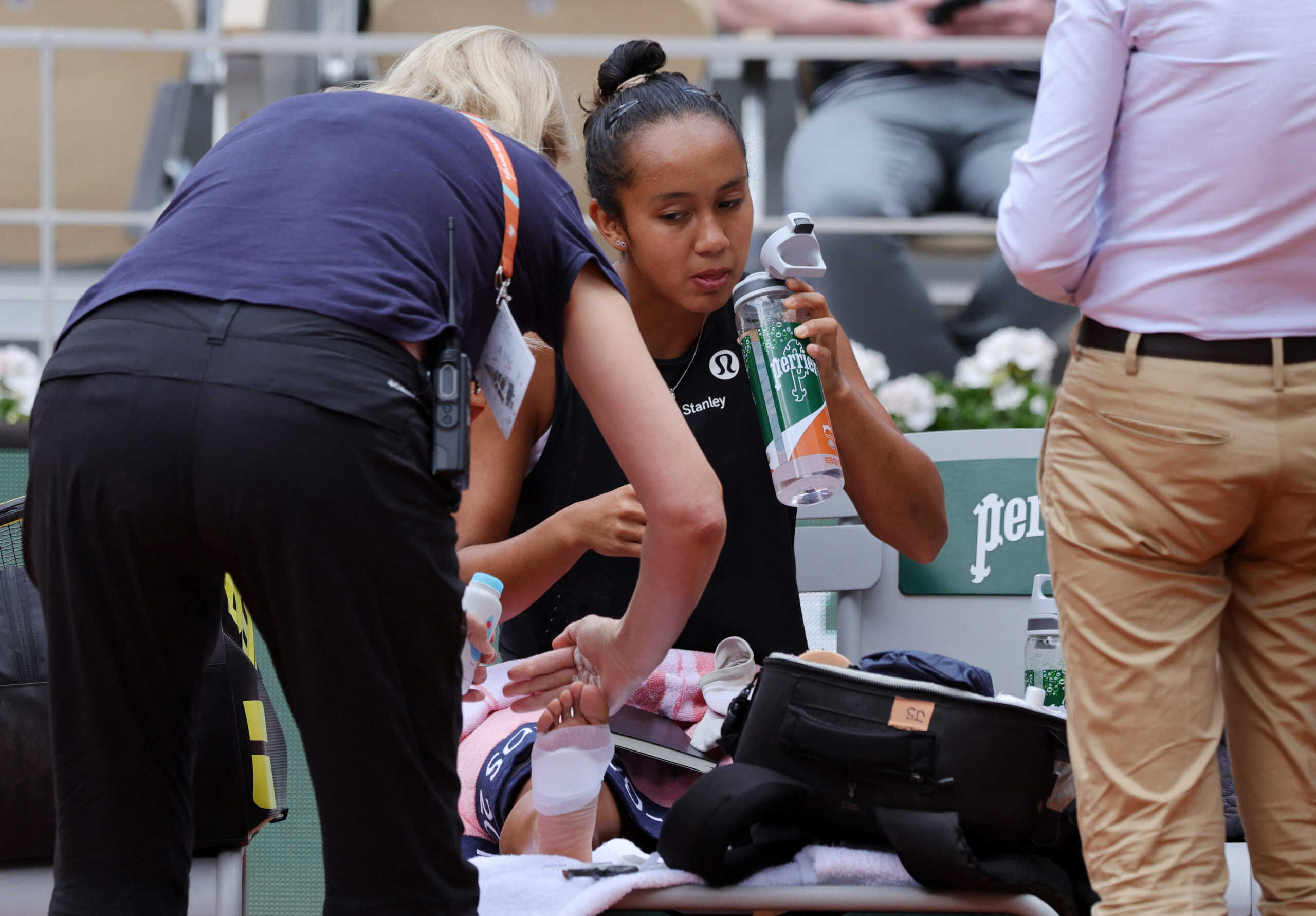 Tennis - French Open - Roland Garros, Paris, France - May 31, 2022  Canada's Leylah Annie Fernandez receives medical attention during her quarter final match against Italy's Martina Trevisan REUTERS