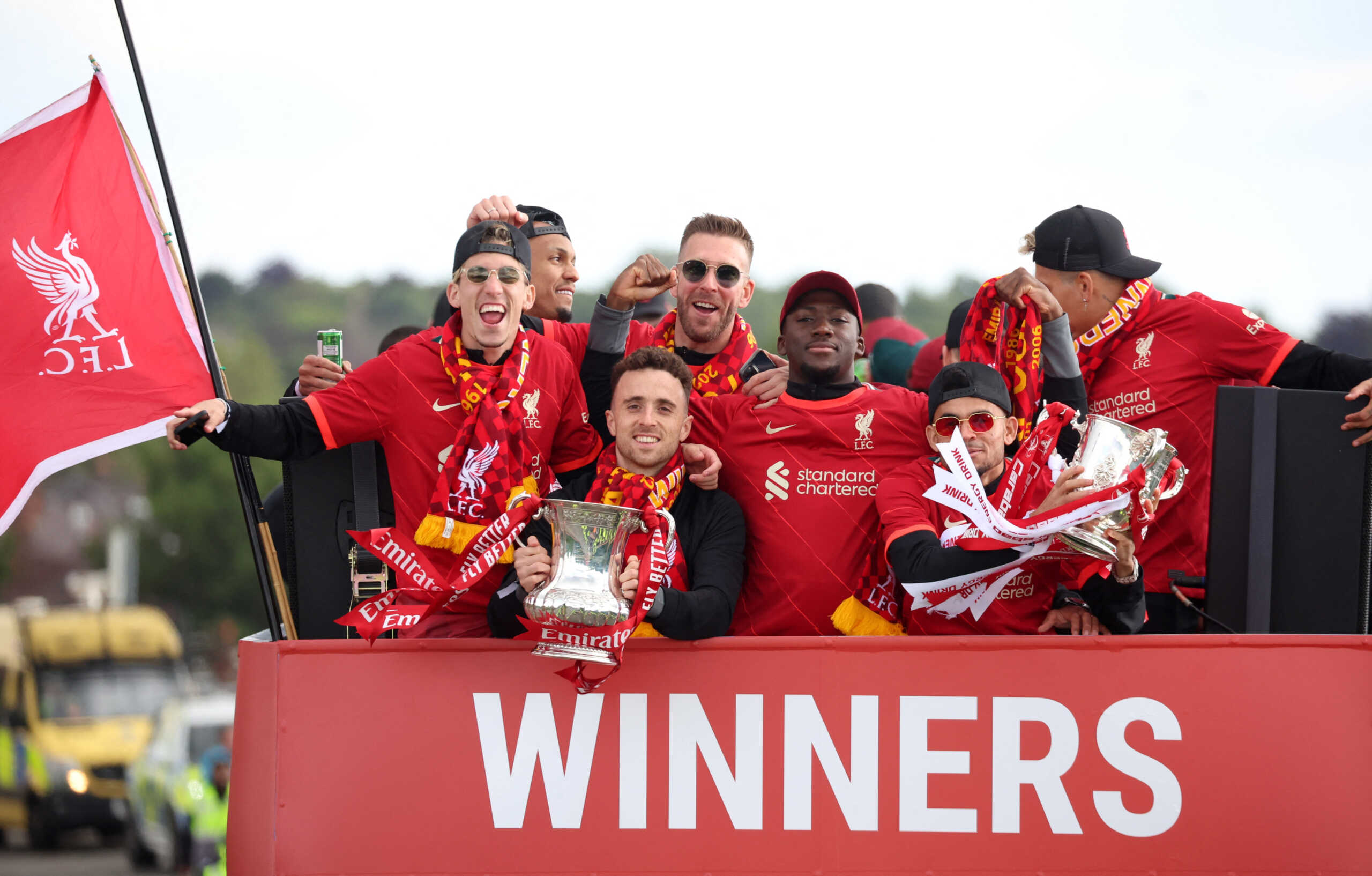 Soccer Football - Liverpool victory parade - Liverpool, Britain - May 29, 2022 Liverpool's Diogo Jota and Luis Diaz celebrate with the FA Cup and the Carabao Cup trophies during the bus parade REUTERS