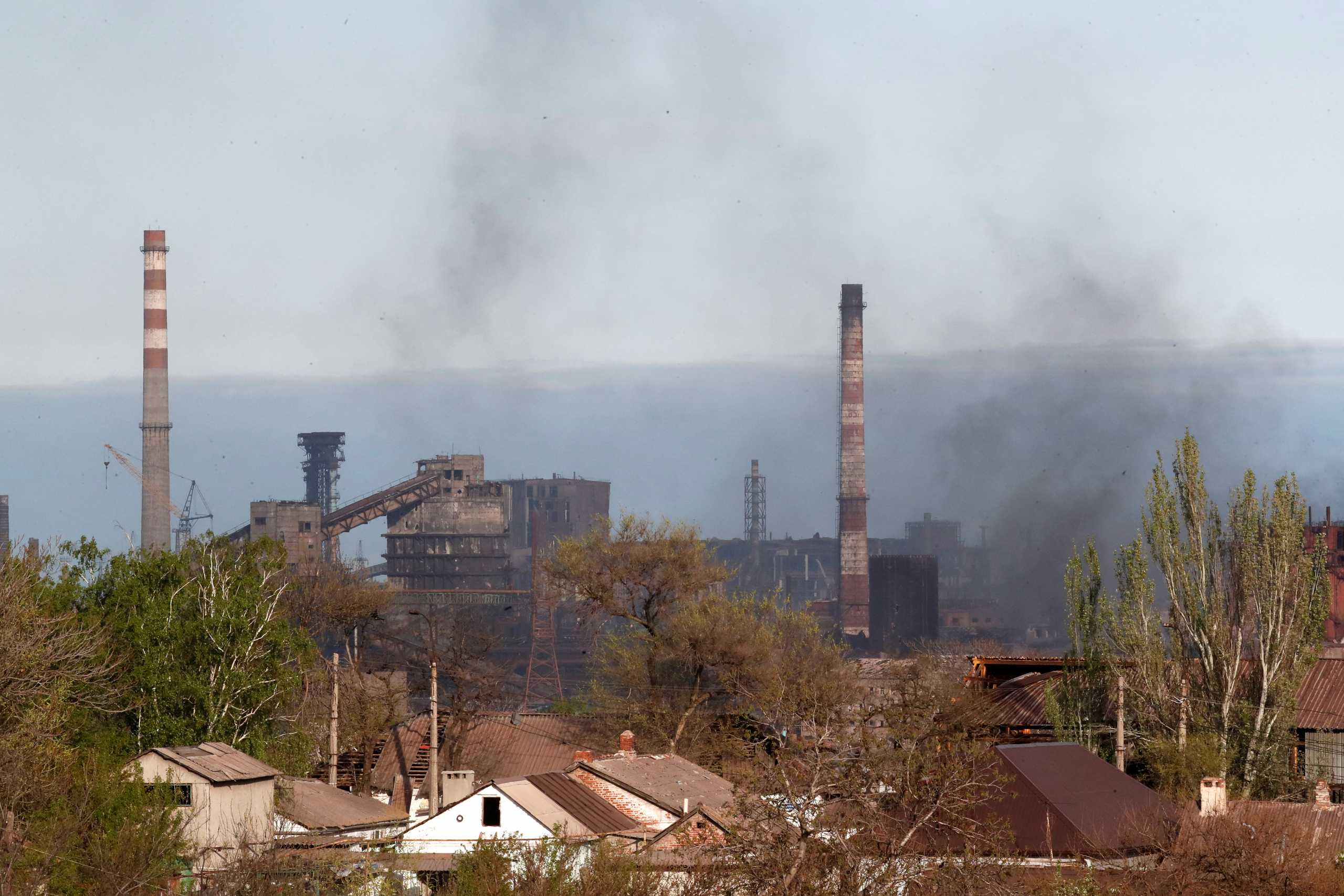 Smoke rises above a plant of Azovstal Iron and Steel Works during Ukraine-Russia conflict in the southern port city of Mariupol, Ukraine May 3, 2022. REUTERS