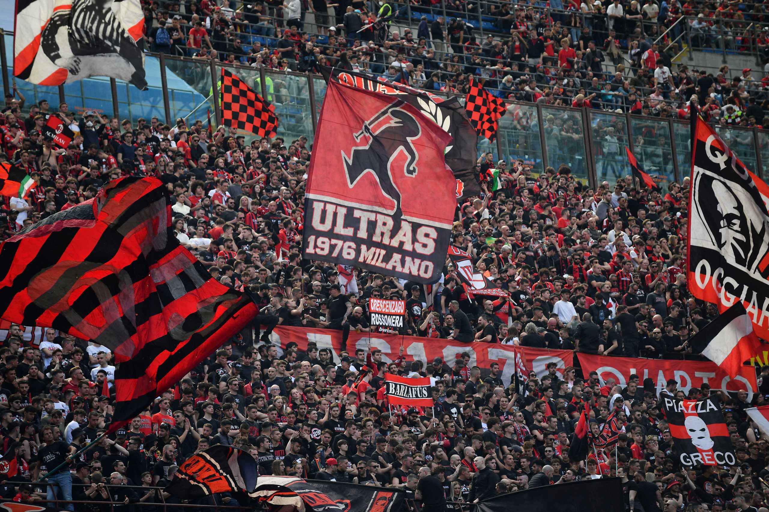 Soccer Football - Serie A - AC Milan v Fiorentina - San Siro, Milan, Italy - May 1, 2022 AC Milan fans wave flags and display banners inside the stadium before the match REUTERS