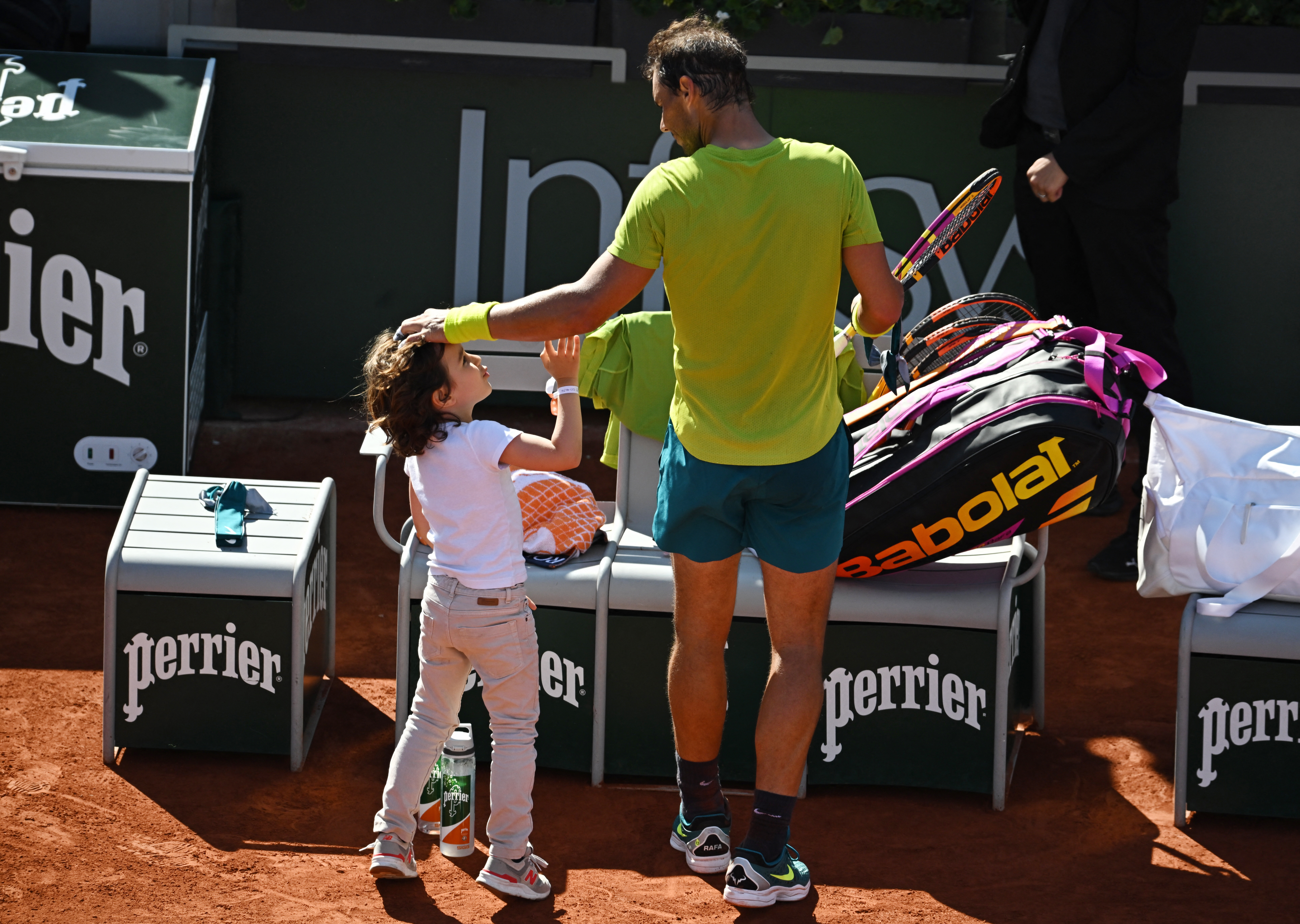 Tennis - French Open - Roland Garros, Paris, France - May 27, 2022 A child is pictured with Spain's Rafael Nadal after his third round match against Netherlands' Botic Van De Zandschulp REUTERS