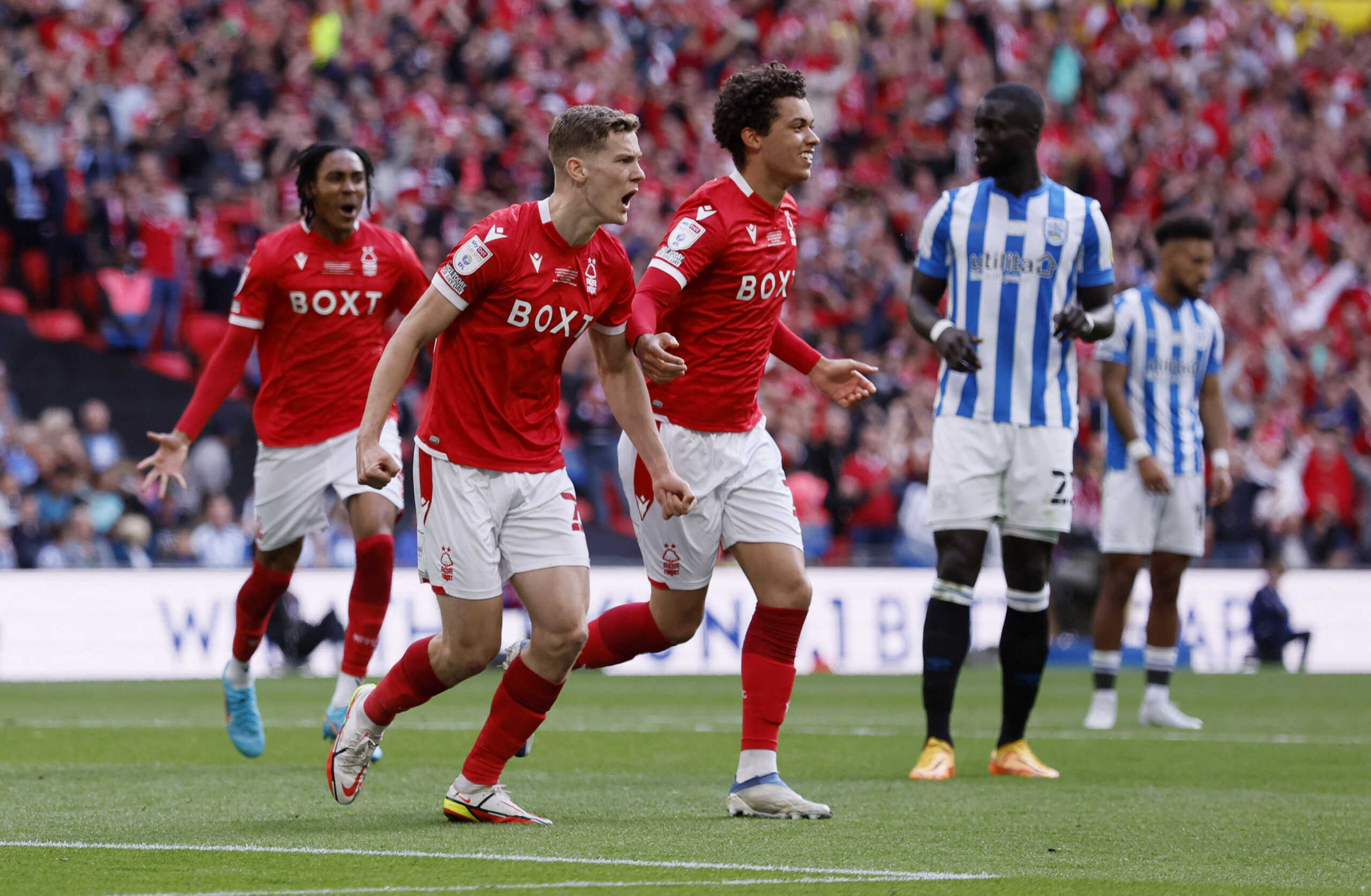 Soccer Football - Championship Play-Off Final - Huddersfield Town v Nottingham Forest - Wembley Stadium, London, Britain - May 29, 2022 Nottingham Forest's Ryan Yates and Brennan Johnson celebrate after Huddersfield Town's Levi Samuels Colwill scores an own goal and Nottingham Forest's first Action Images via Reuters