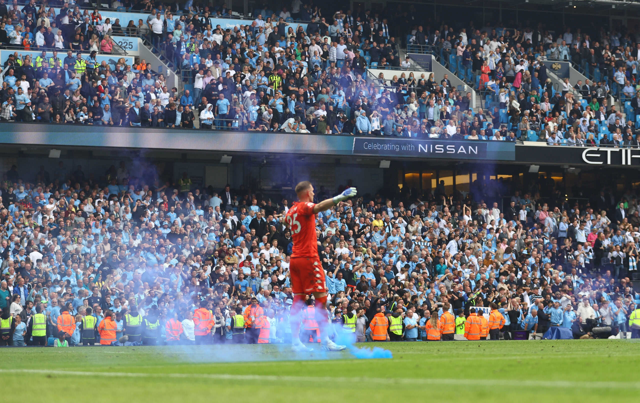 Soccer Football - Premier League - Manchester City v Aston Villa - Etihad Stadium, Manchester, Britain - May 22, 2022 Aston Villa's Robin Olsen reacts as a flare is thrown onto the pitch after Manchester City score their second goal REUTERS