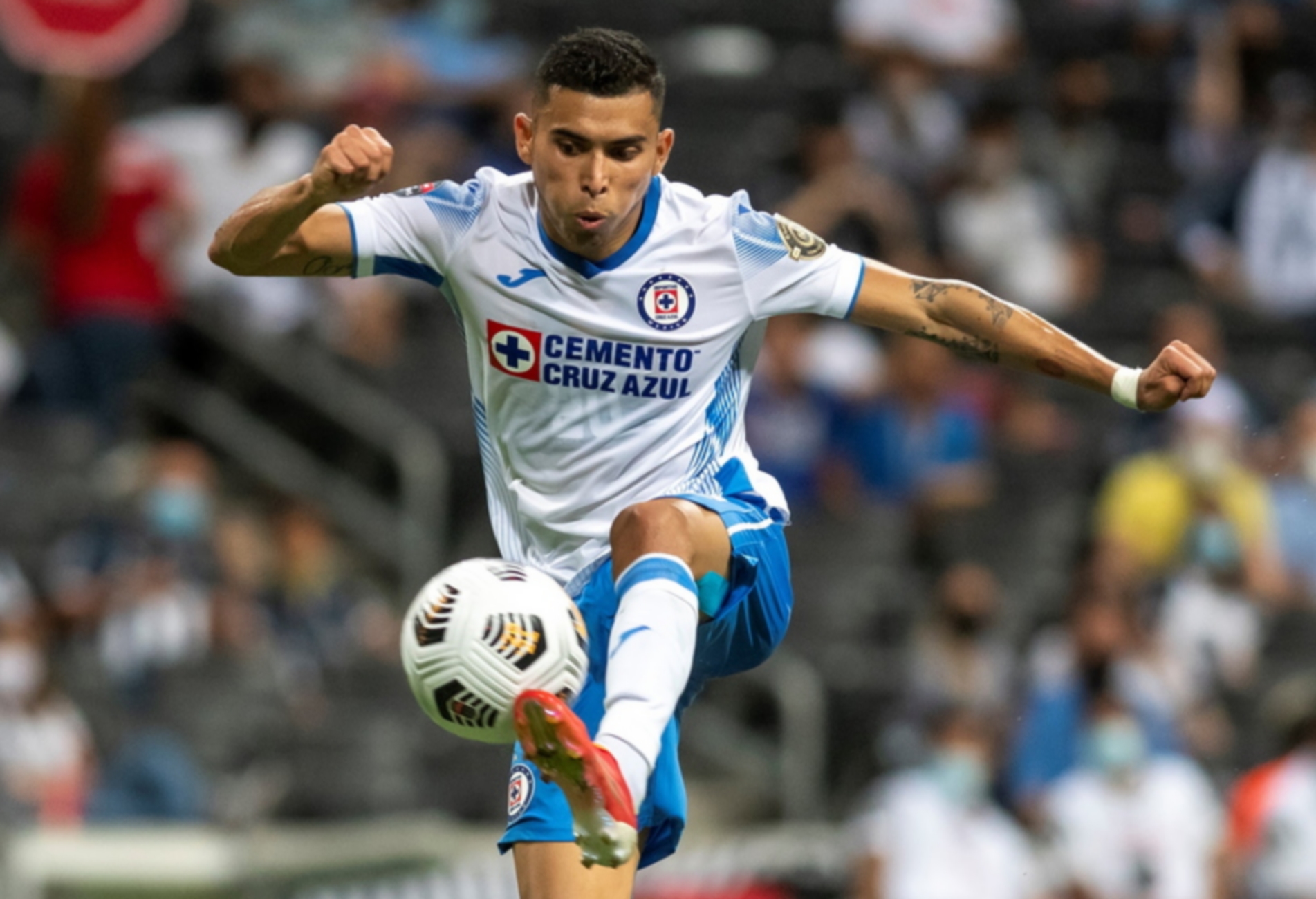 epa09410592 Cruz Azul's Orbelin Pineda in action during the CONCACAF Champions League semifinal soccer match between Monterrey and Cruz Azul at the BBVA Stadium in Guadalupe, Greater Monterrey, Mexico, 11 August 2021.  EPA