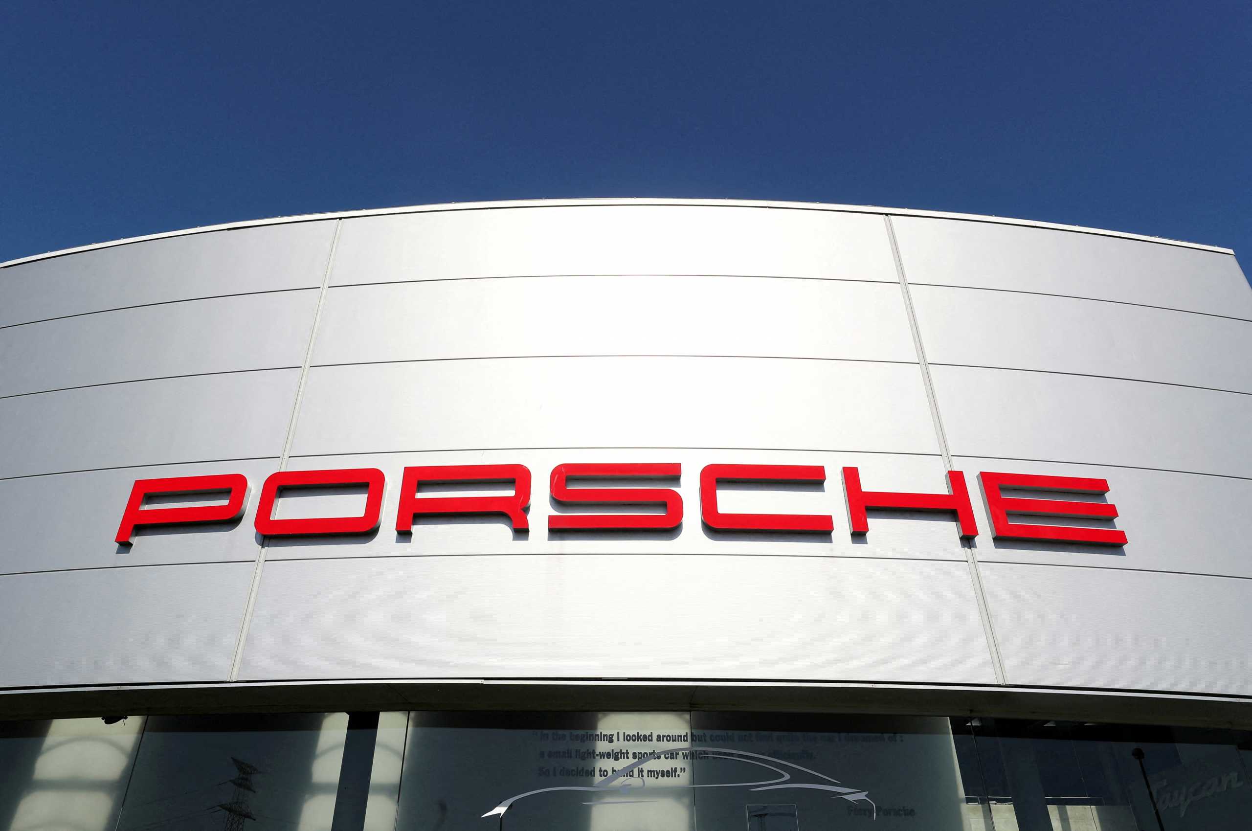 FILE PHOTO: A logo of Porsche is seen outside a Porsche car dealer, amid the coronavirus disease (COVID-19) outbreak in Brussels, Belgium May 28, 2020. REUTERS