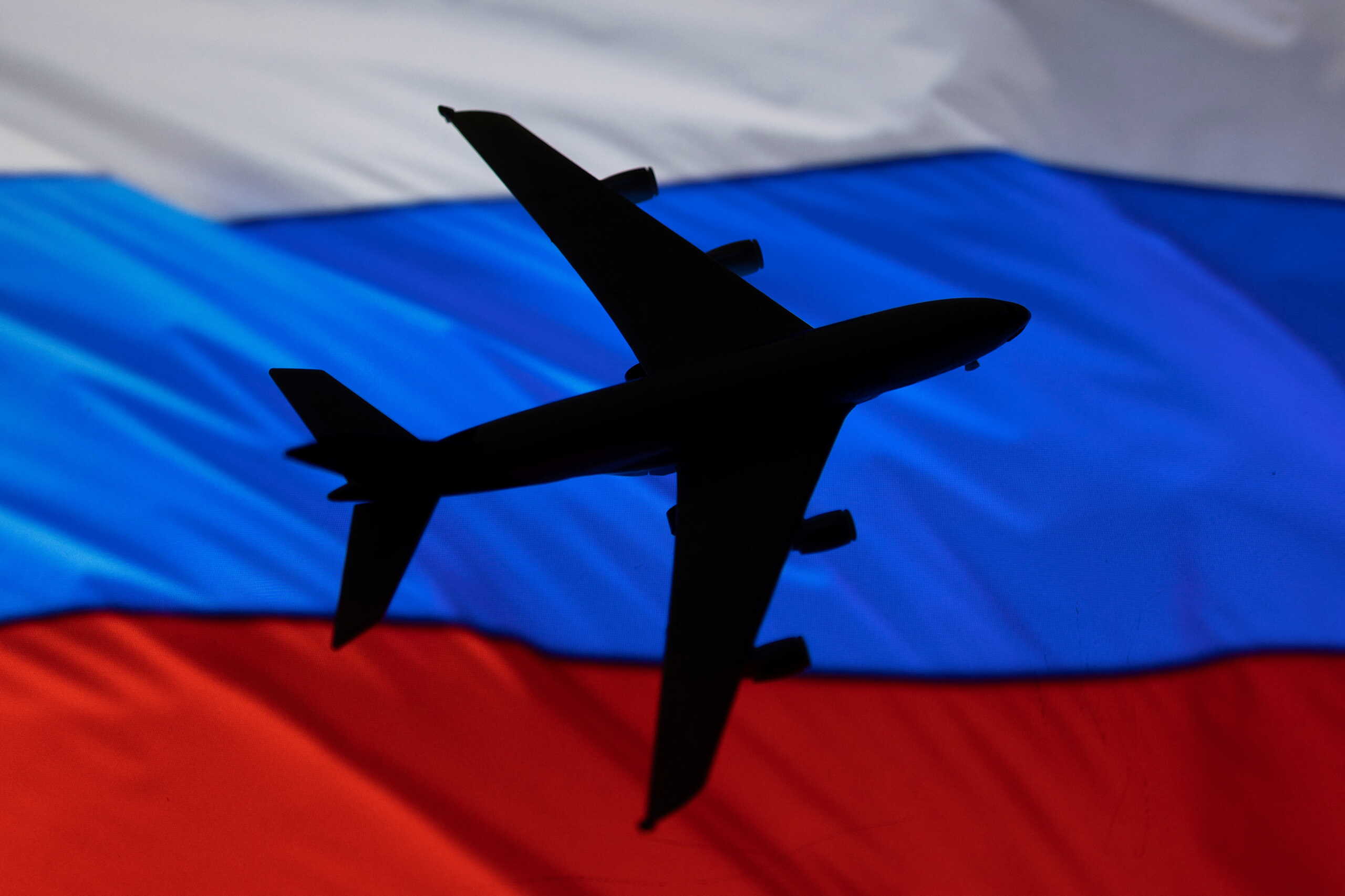 A model of an airplane and a Russian flag is displayed in this illustration taken, May 4, 2022. REUTERS