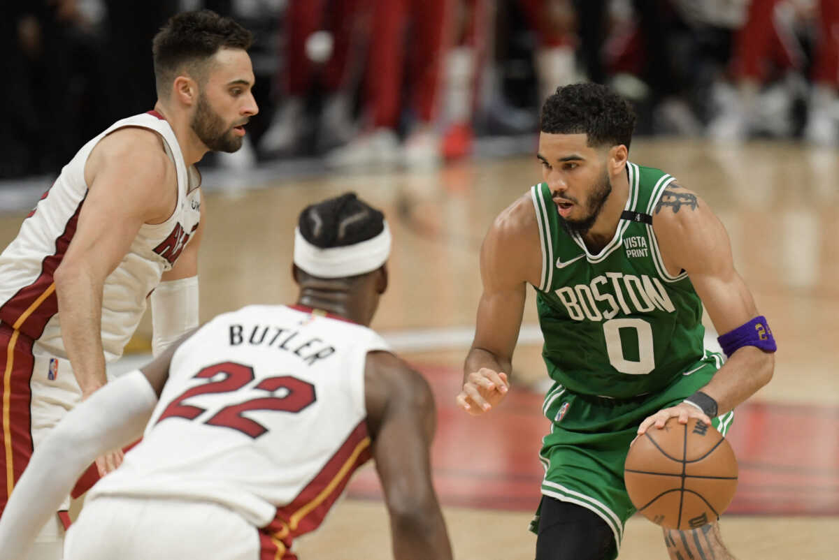 May 29, 2022; Miami, Florida, USA; Boston Celtics forward Jayson Tatum (0) drives to the basket against Miami Heat guard Max Strus (31) and forward Jimmy Butler (22) during the second half of game seven of the 2022 eastern conference finals at FTX Arena. Mandatory Credit: Jim Rassol-USA TODAY Sports