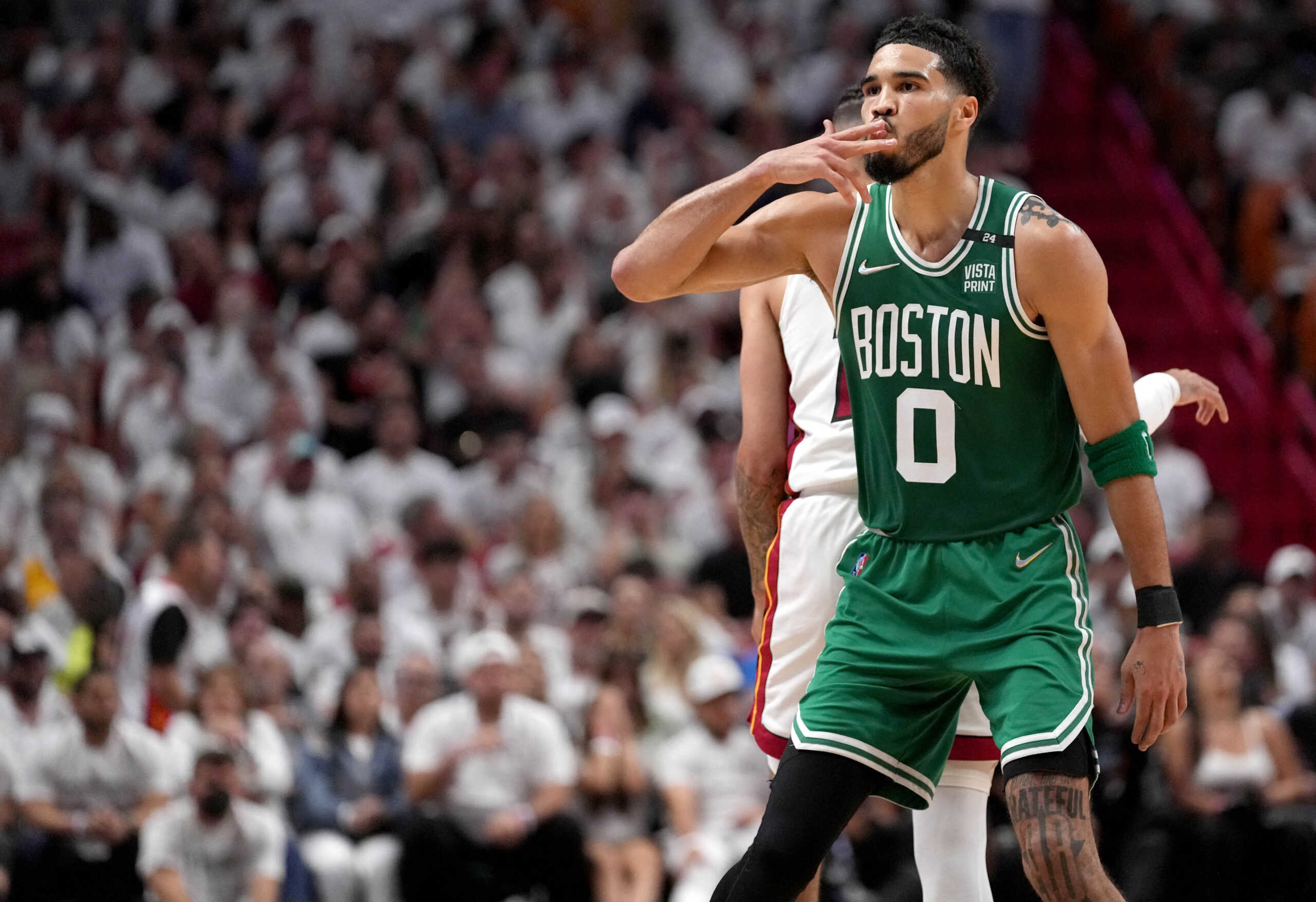 May 17, 2022; Miami, Florida, USA; Boston Celtics forward Jayson Tatum (0) reacts after a three point shot against the Miami Heat during the first half of game one of the 2022 eastern conference finals at FTX Arena. Mandatory Credit: Jasen Vinlove-USA TODAY Sports
