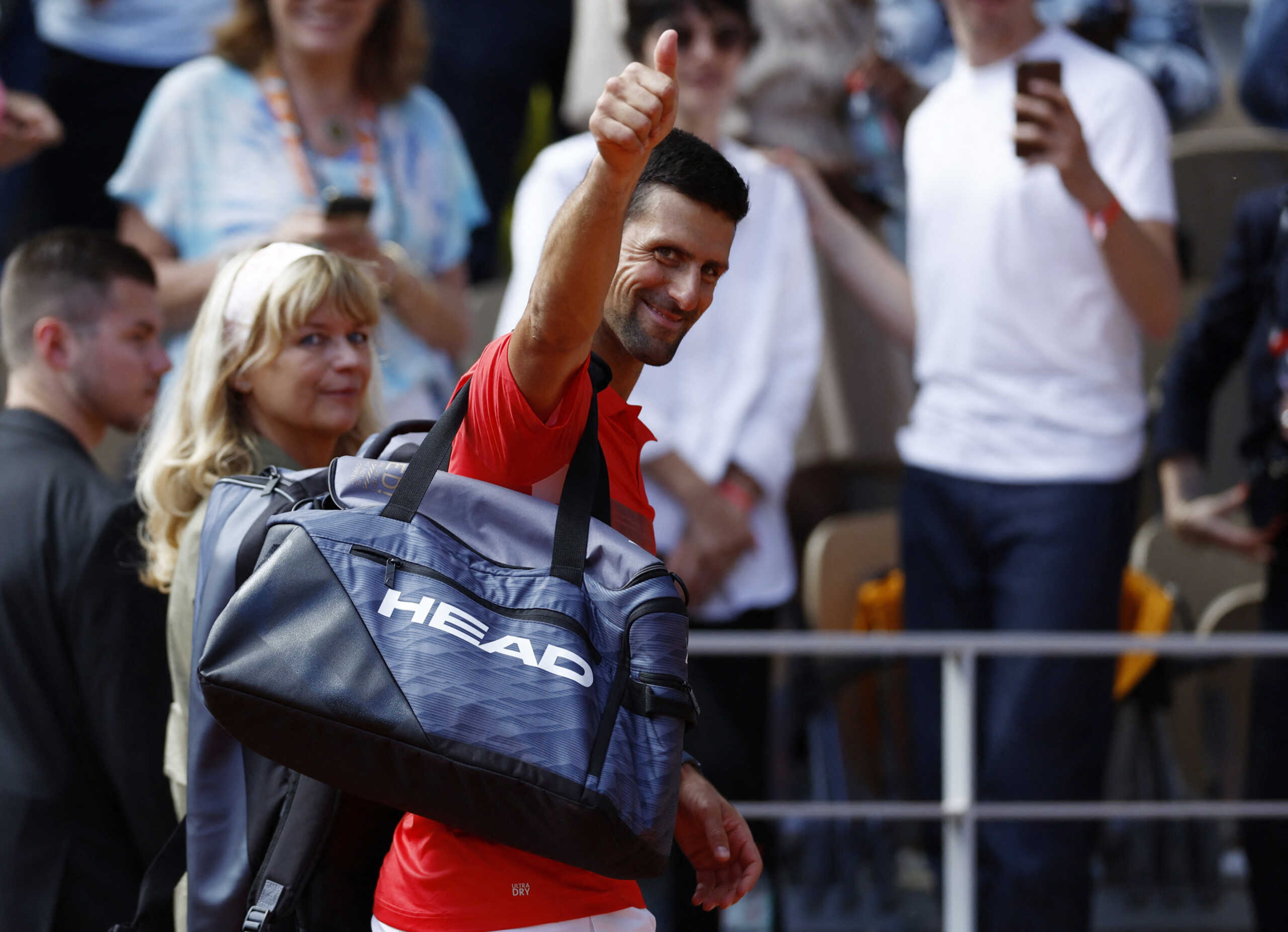 Tennis - French Open - Roland Garros, Paris, France - May 27, 2022 Serbia's Novak Djokovic celebrates as he leaves the court after winning his third round match against Slovenia's Aljaz Bedene REUTERS