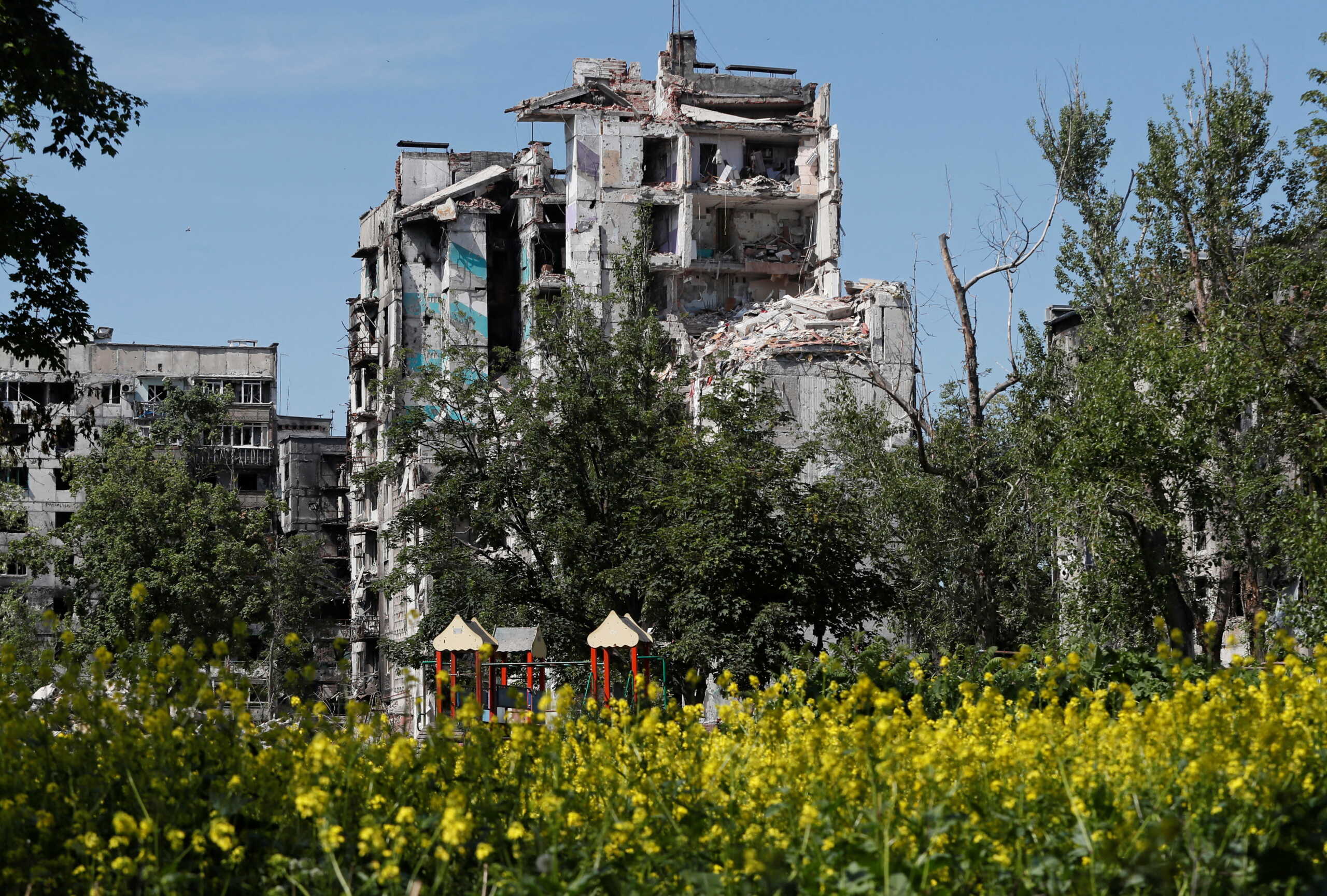 A view shows a residential building heavily damaged during Ukraine-Russia conflict in the southern port city of Mariupol, Ukraine May 30, 2022. REUTERS