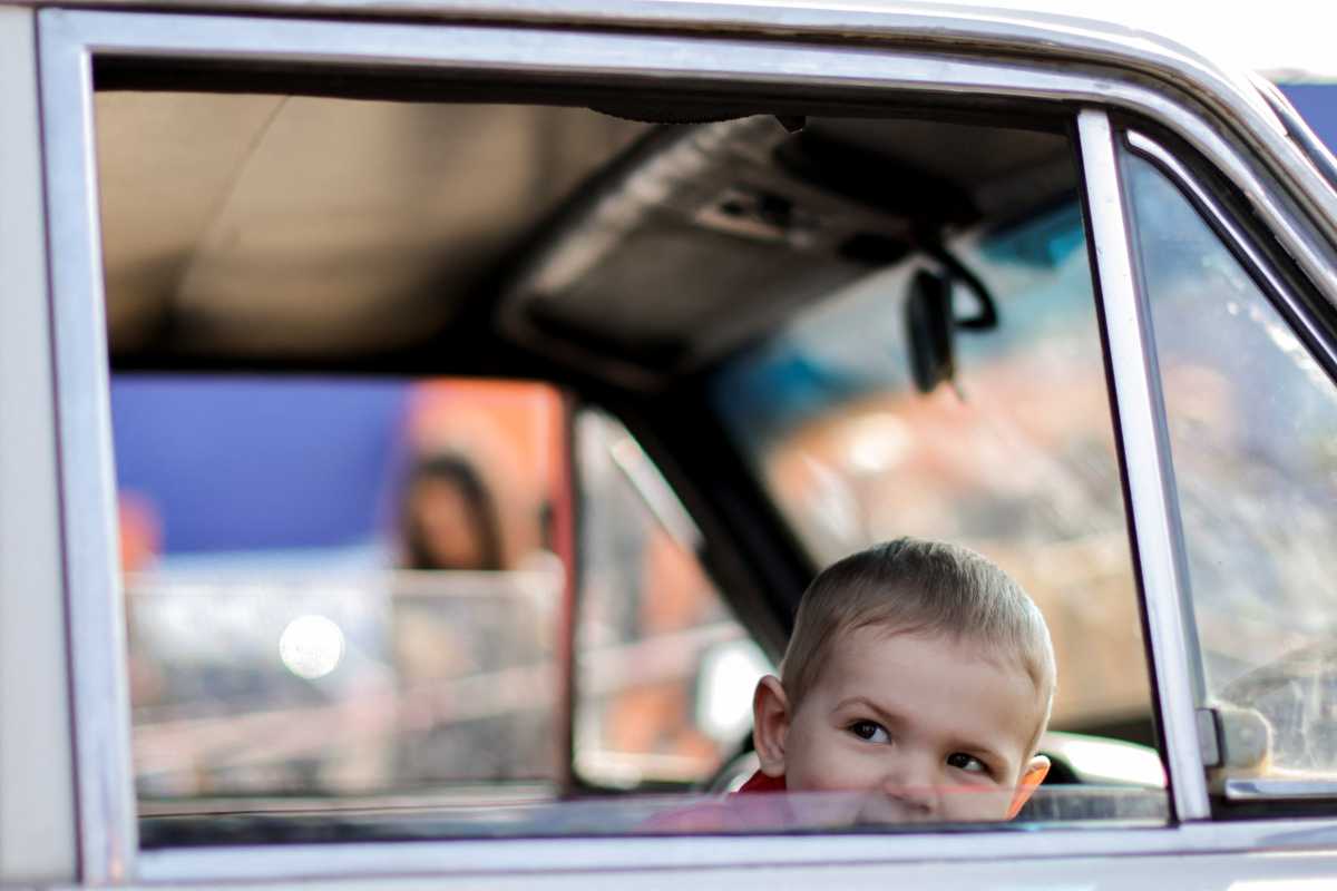 A Ukrainian boy refugee from Mariupol area, looks out of a vehicle's window after arriving at a registration centre for internally displaced people, amid Russia's ongoing invasion of Ukraine, in Zaporizhzhia, Ukraine May 2, 2022. REUTERS