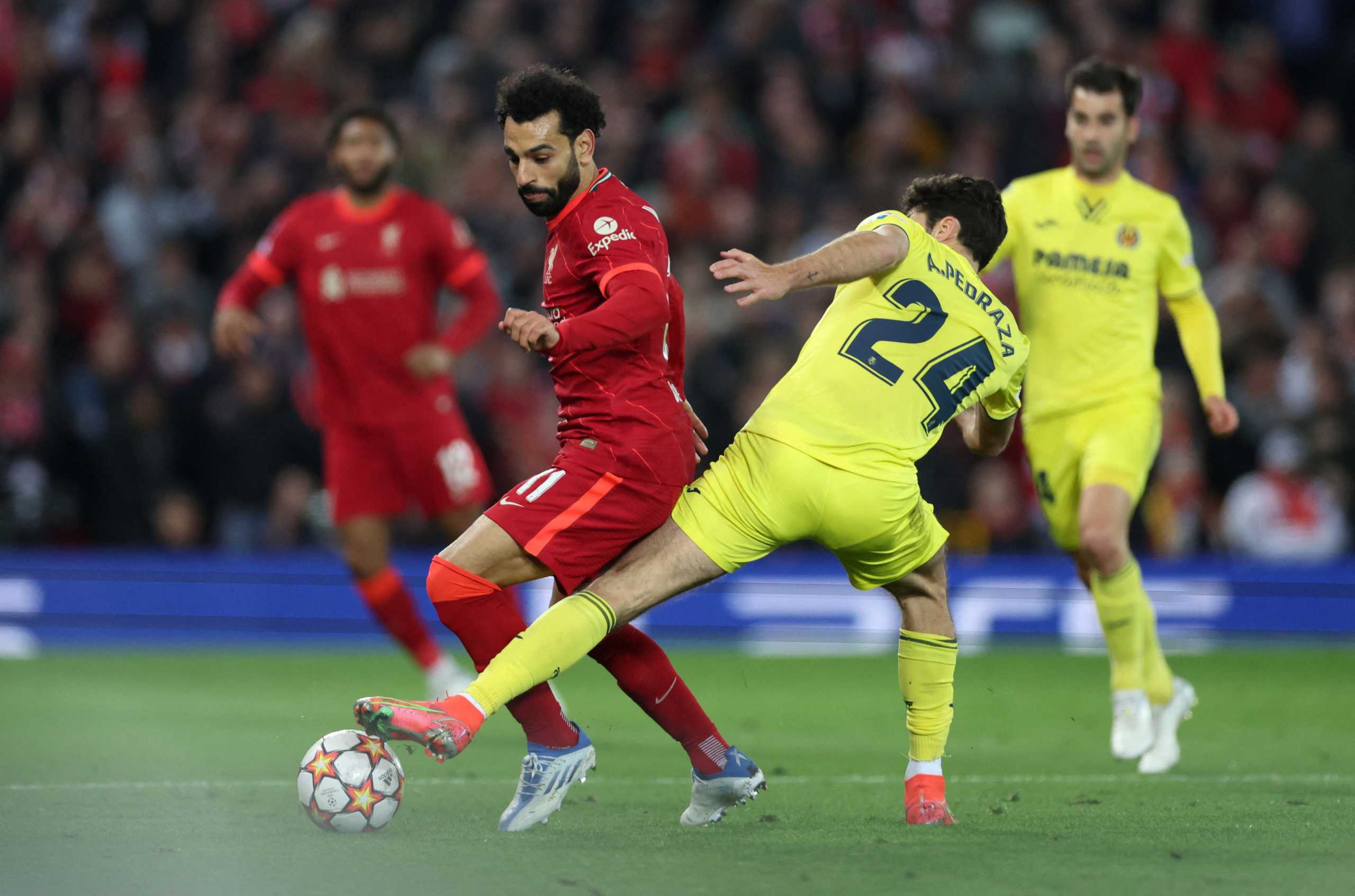 Soccer Football - Champions League - Semi Final - First Leg - Liverpool v Villarreal - Anfield, Liverpool, Britain - April 27, 2022 Liverpool's Mohamed Salah in action with Villarreal's Alfonso Pedraza Action Images via Reuters
