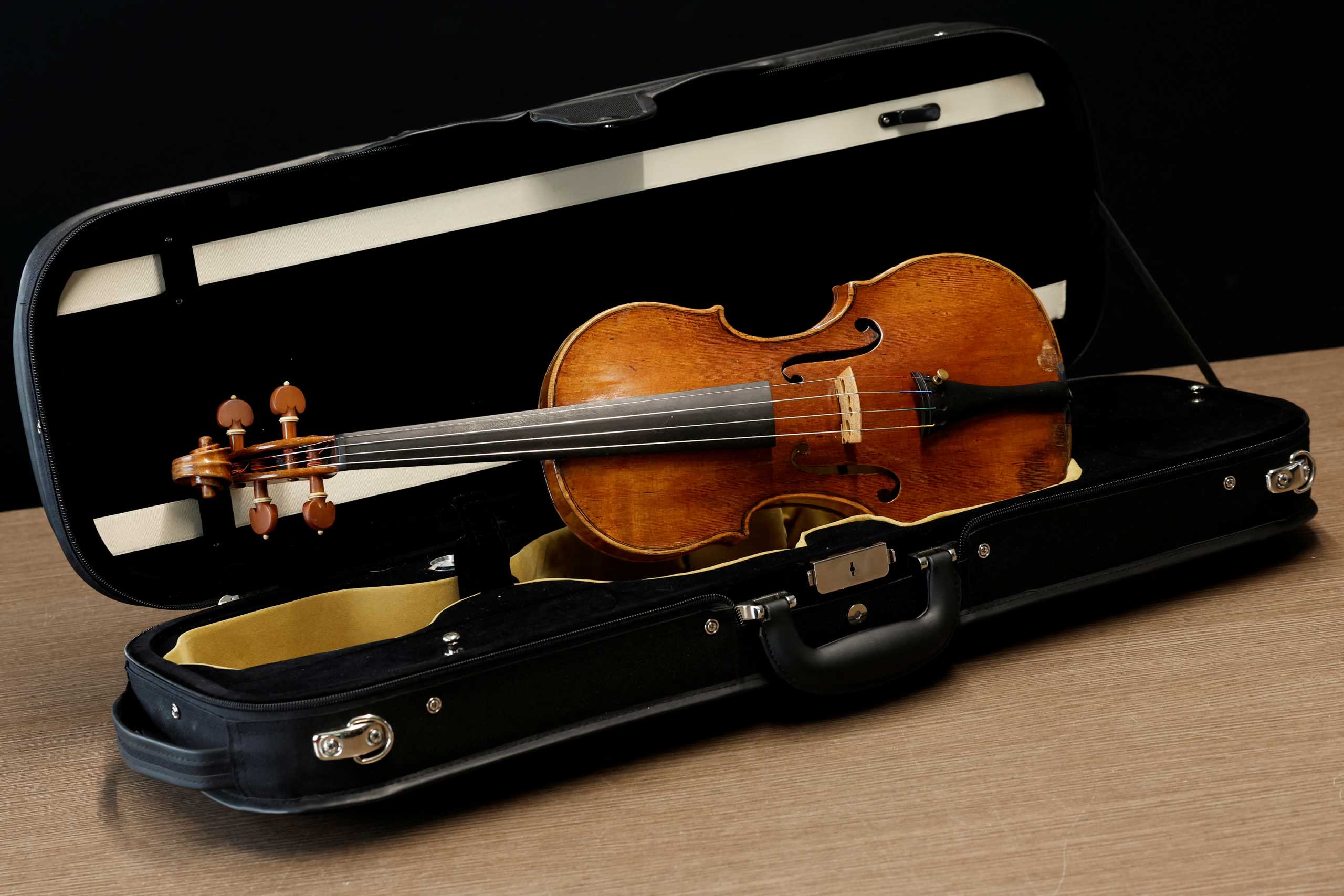 A rare 1736 violin by Italian luthier Guarneri del Gesu is displayed during a media preview at Aguttes auction house ahead of the violin's auction in Neuilly-sur-Seine, near Paris, France, April 26, 2022. Picture taken April 26, 2022. REUTERS