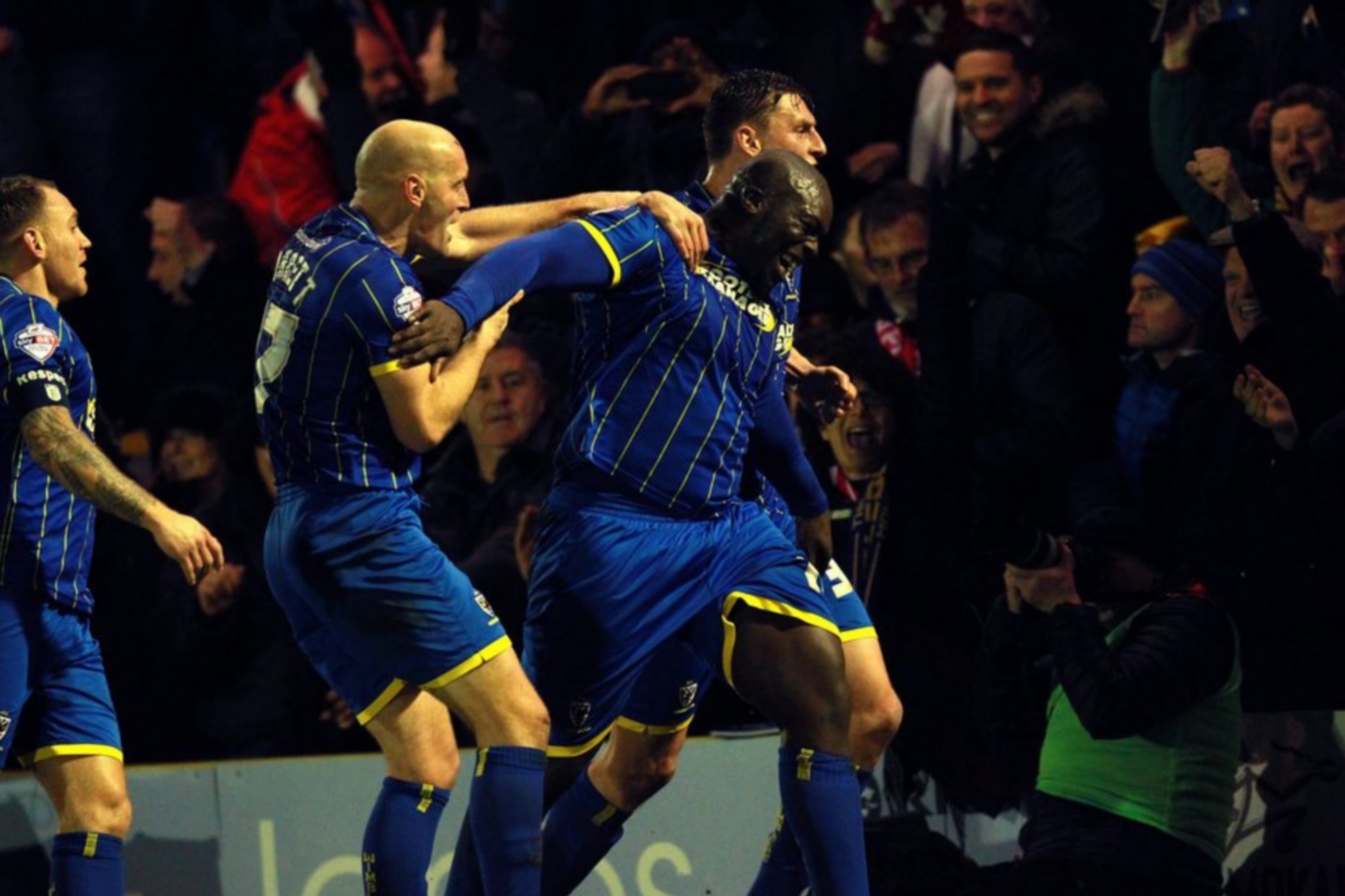 epa04547738 Wimbledon's Adebayo Akinfenwa (C) celebrates his goal during the English FA Cup third round match between AFC Wimbledon and Liverpool FC at the Kingsmeadow stadium in London, Britain, 05 January 2015.  EPA
http: