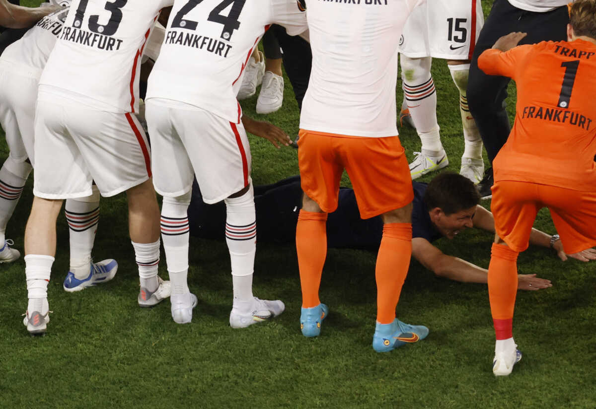 Soccer Football - Europa League - Final - Eintracht Frankfurt v Rangers - Ramon Sanchez Pizjuan, Seville, Spain - May 19, 2022  Eintracht Frankfurt coach Oliver Glasner is seen on the floor during a guard of honor as he celebrates after winning the Europa League REUTERS