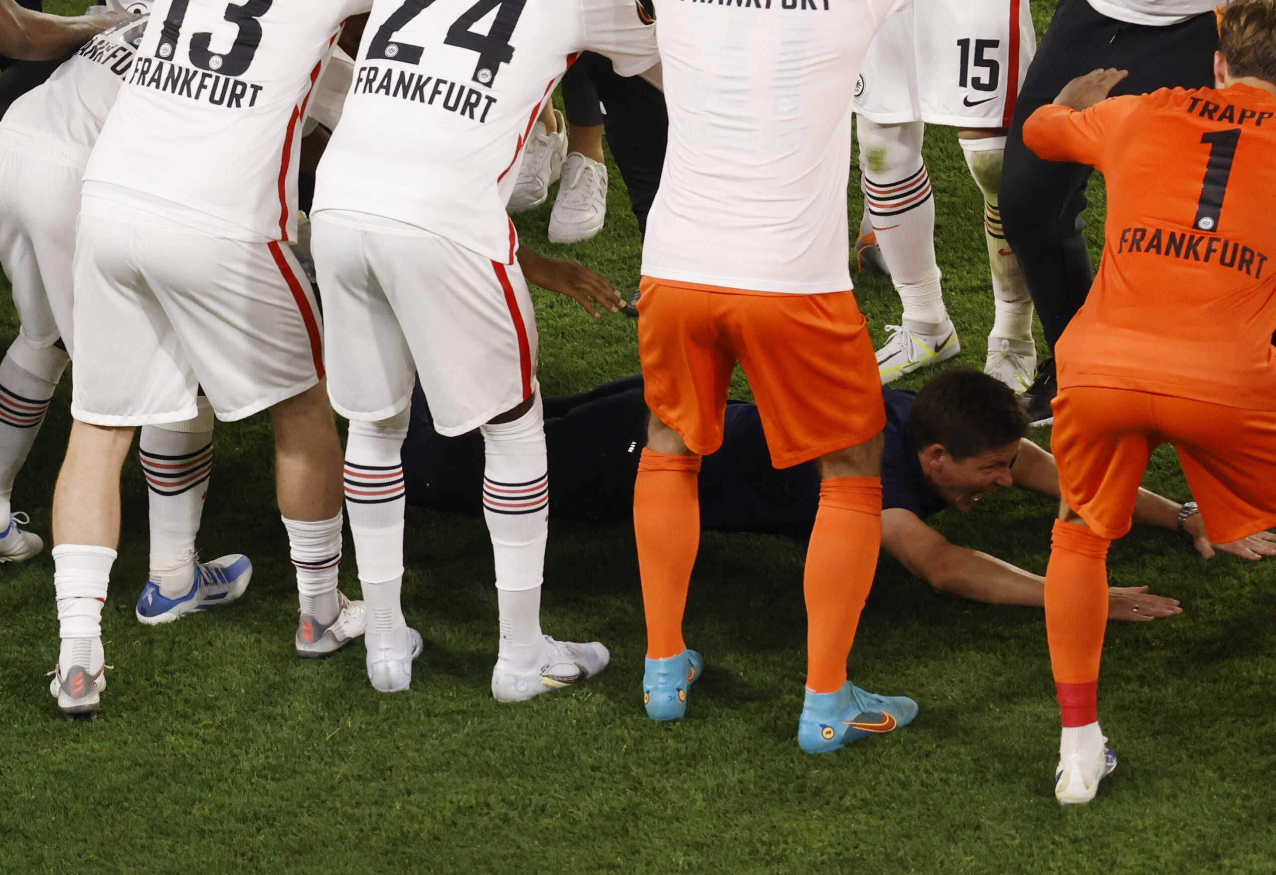 Soccer Football - Europa League - Final - Eintracht Frankfurt v Rangers - Ramon Sanchez Pizjuan, Seville, Spain - May 19, 2022  Eintracht Frankfurt coach Oliver Glasner is seen on the floor during a guard of honor as he celebrates after winning the Europa League REUTERS