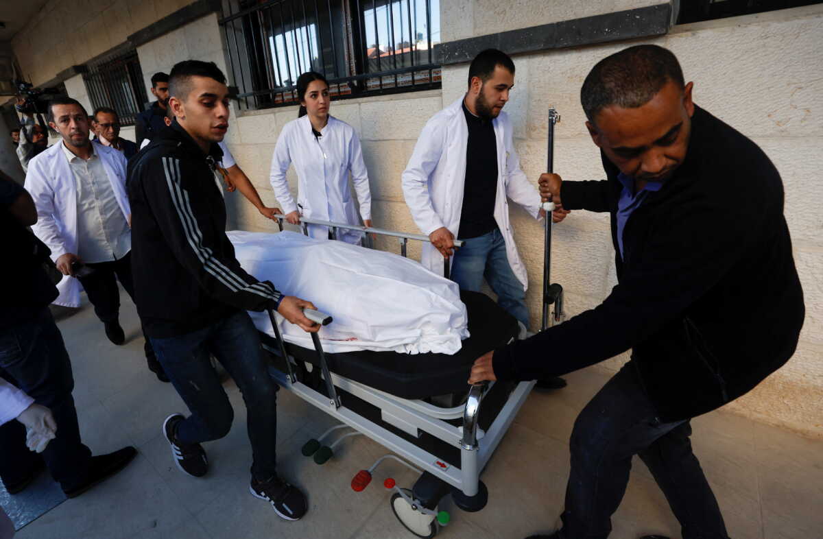 The body of Al Jazeera reporter Shireen Abu Akleh is carried on a stretcher at a hospital following an Israeli raid, in Jenin in the Israeli-occupied West Bank May 11, 2022. REUTERS