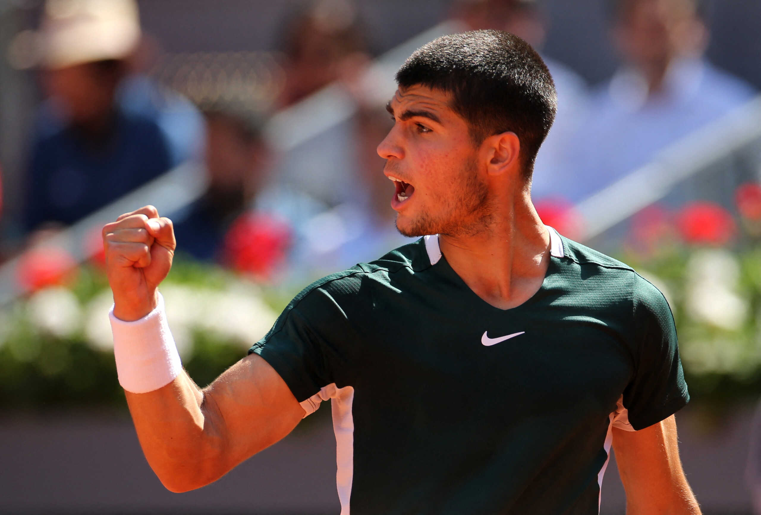 Tennis - ATP Masters 1000 - Madrid Open - Caja Magica, Madrid, Spain - May 6, 2022 Spain's Carlos Alcaraz Garfia celebrates winning the first set during his quarter final match against Spain's Rafael Nadal REUTERS