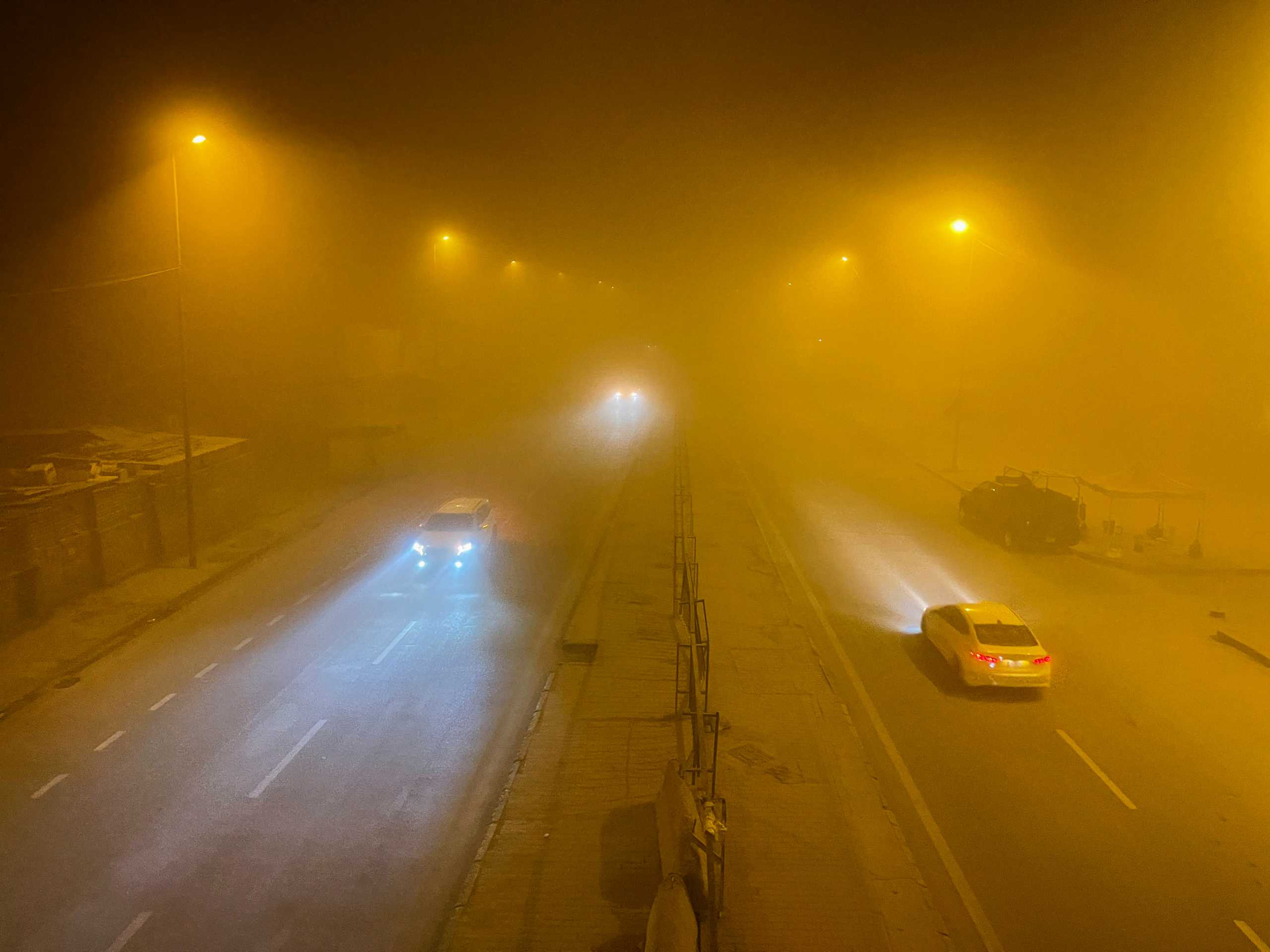 Cars drive on a road amidst a sandstorm, in Baghdad, Iraq, May 5, 2022. REUTERS