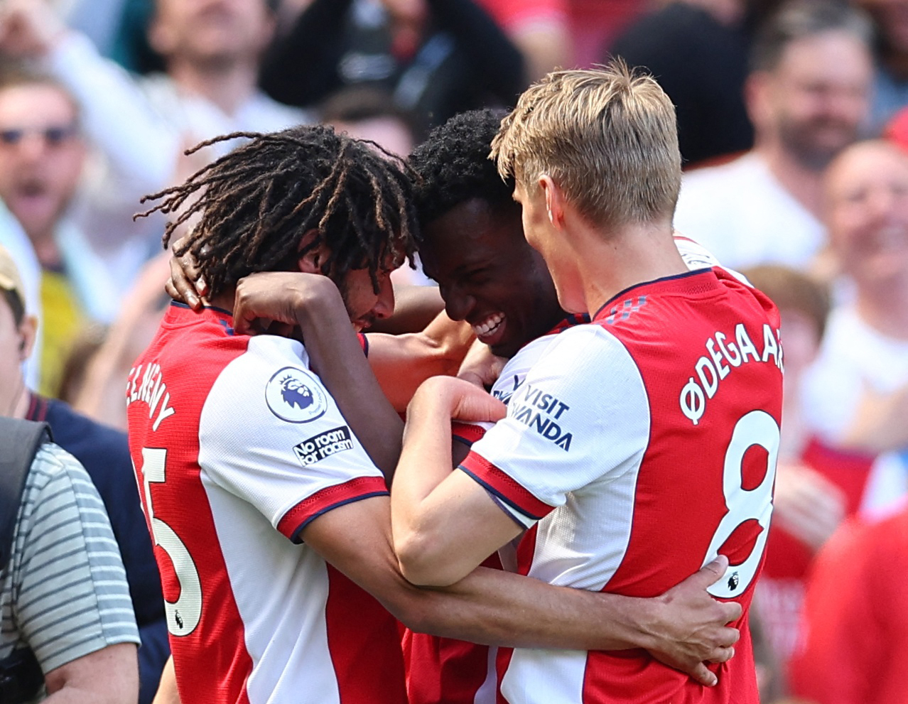Soccer Football - Premier League - Arsenal v Leeds United - Emirates Stadium, London, Britain - May 8, 2022 Arsenal's Eddie Nketiah celebrates scoring their second goal with Mohamed Elneny and Martin Odegaard REUTERS