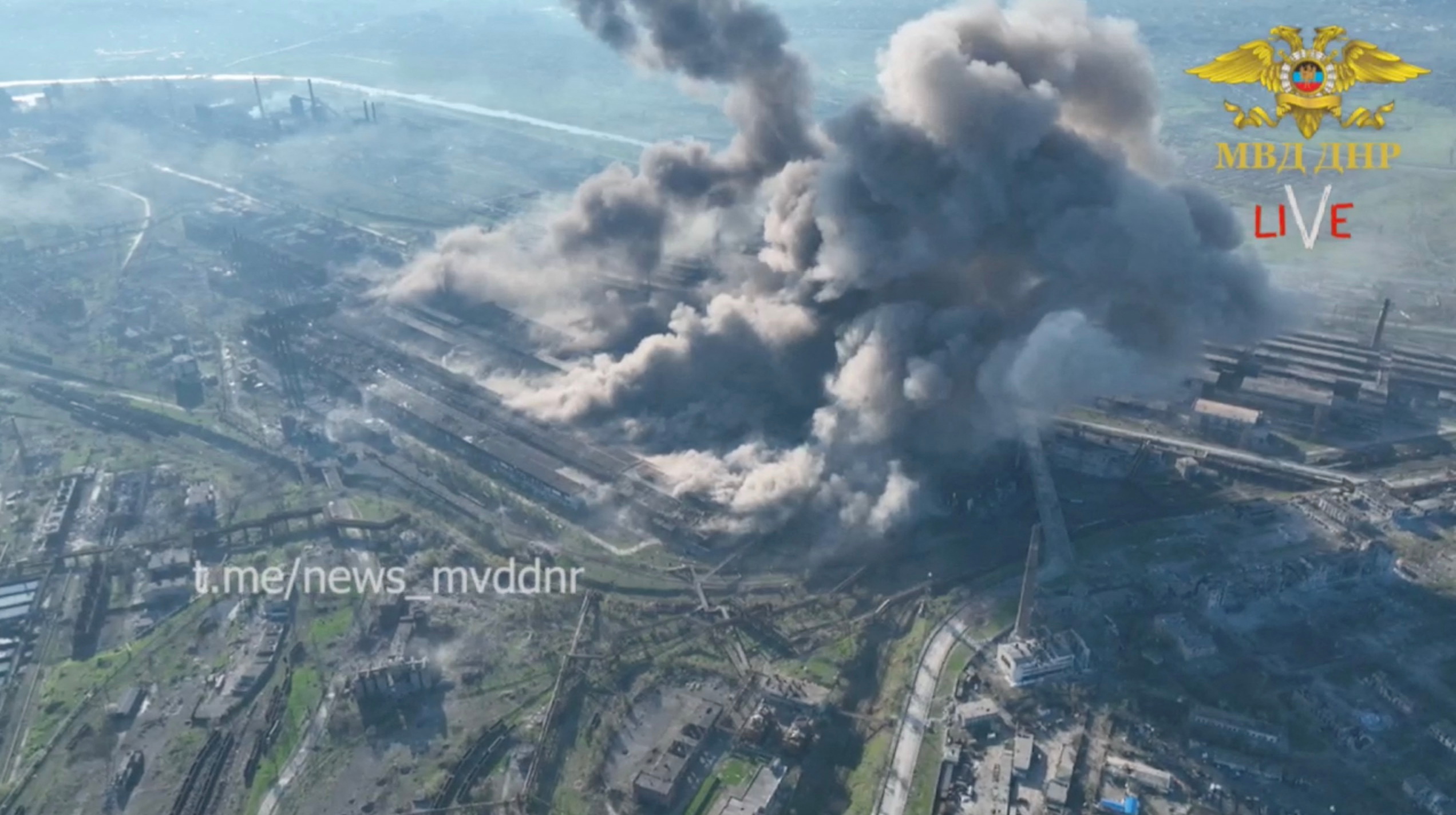 An aerial view of rising smoke after a possible shelling of Azovstal complex, in Mariupol, Ukraine, in this still image from a handout video acquired by Reuters on May 5, 2022.   Ministry of Internal Affairs Donetsk People's Republic