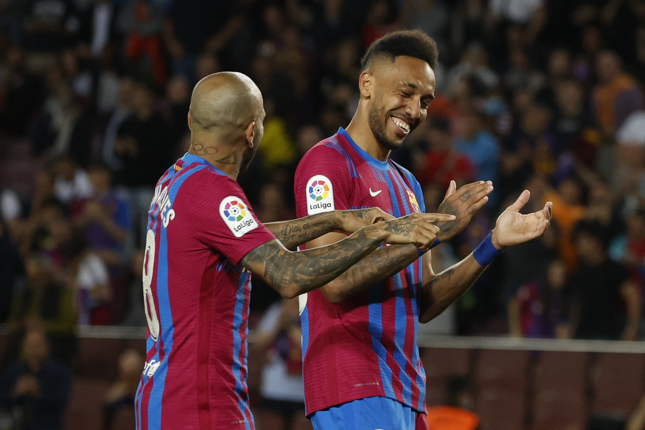 Soccer Football - LaLiga - FC Barcelona v Celta Vigo - Camp Nou, Barcelona, Spain - May 10, 2022 FC Barcelona's Pierre-Emerick Aubameyang celebrates scoring their third goal with Dani Alves REUTERS