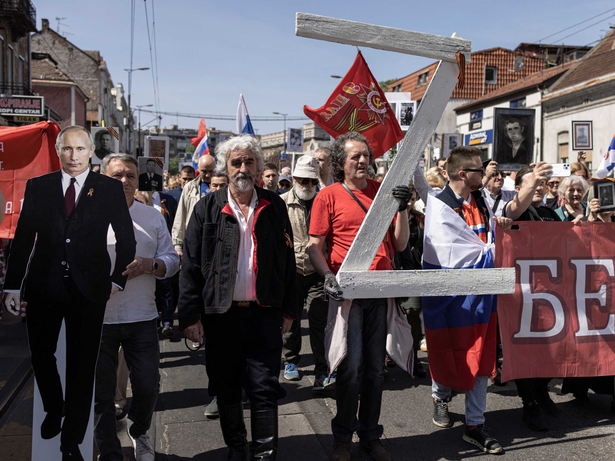 A man carries a wooden made "Z" sign, during the Immortal Regiment march on Victory Day, which marks the 77th anniversary of the victory over Nazi Germany in World War Two in Belgrade, Serbia, May 9, 2022. REUTERS