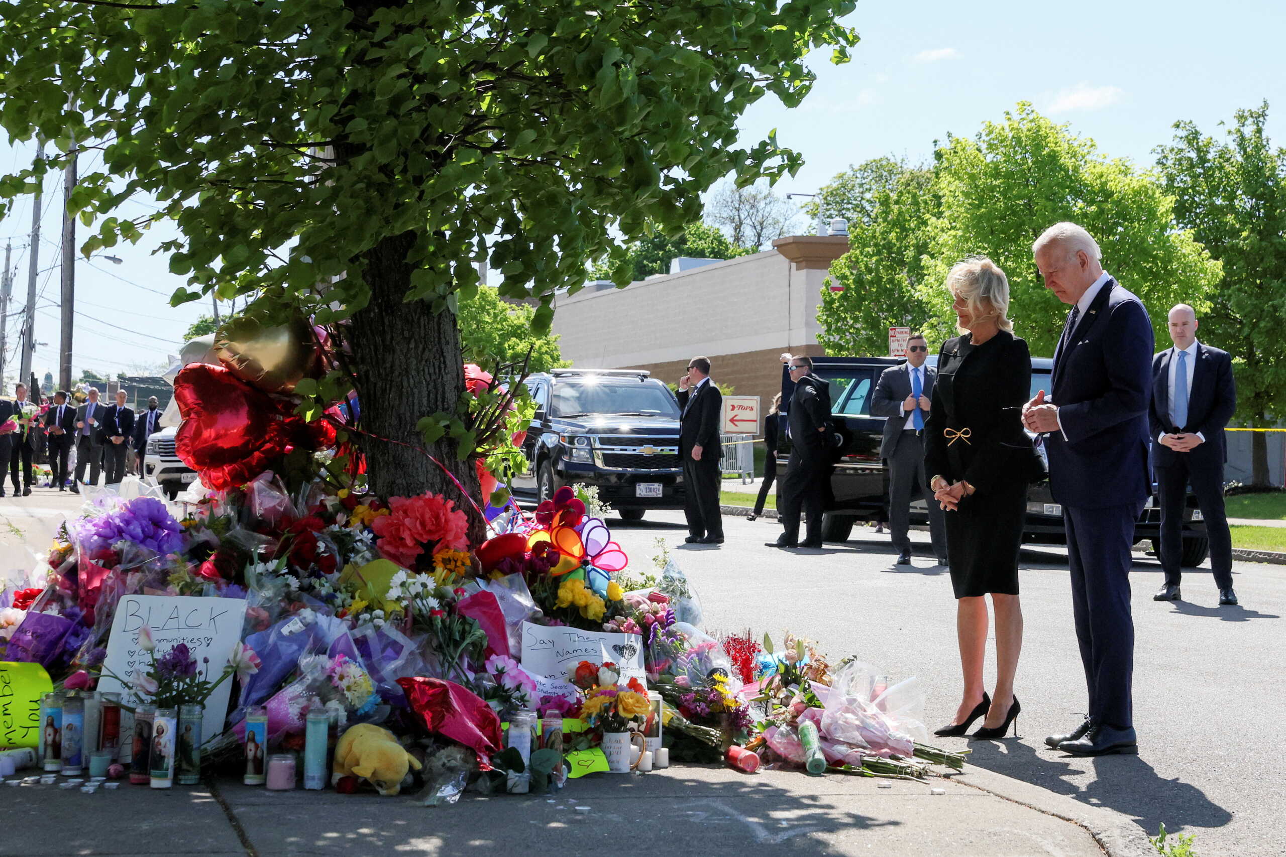 U.S. President Joe Biden and first lady Jill Biden pay their respects to the 10 people killed in a mass shooting by a gunman authorities say was motivated by racism, at the TOPS Friendly Markets memorial site in Buffalo, NY, U.S. May 17, 2022. REUTERS