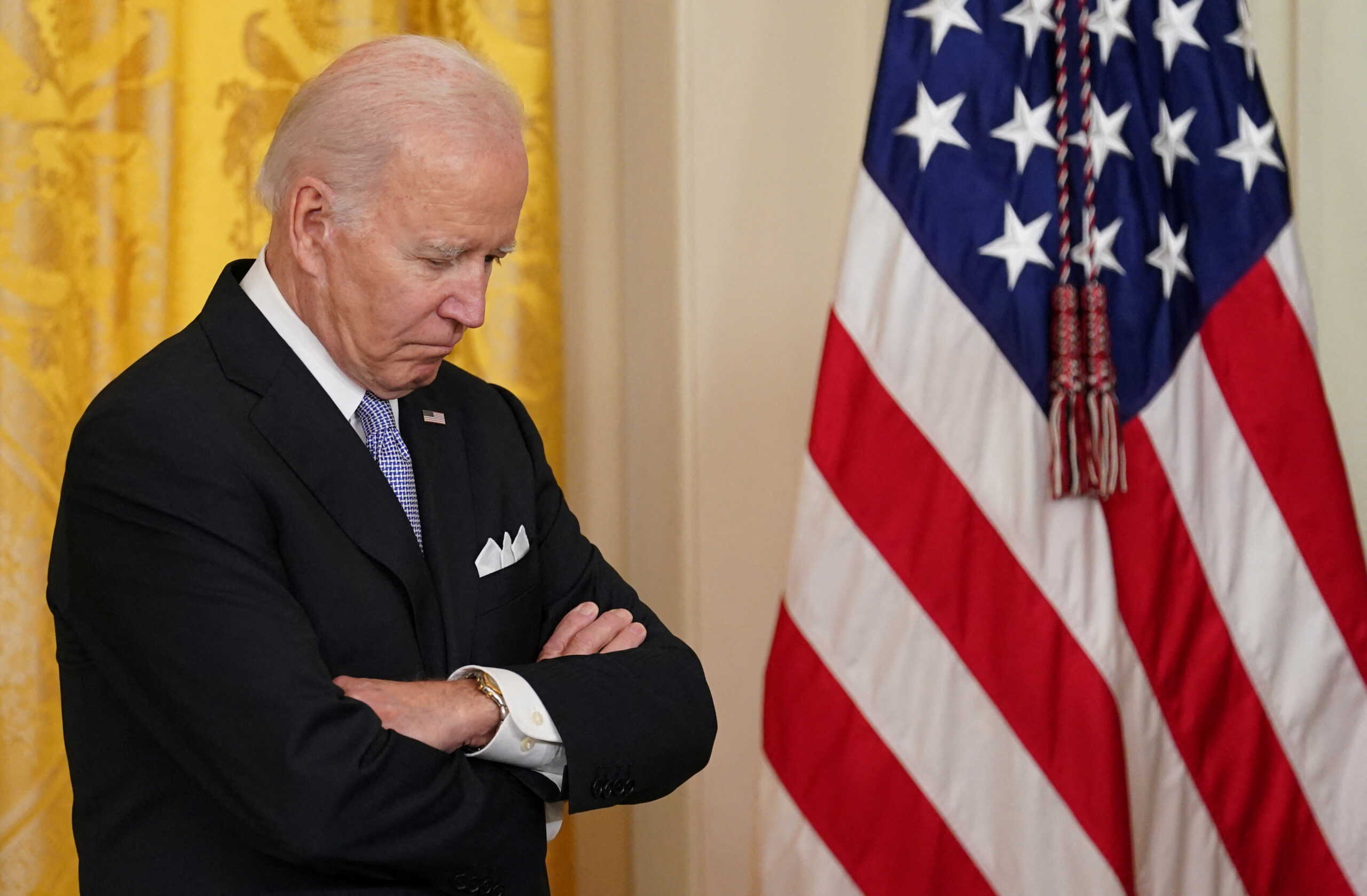 U.S. President Joe Biden listens ahead of the signing of an executive order to reform federal and local policing on the second anniversary of the death of George Floyd, during an event at the White House in Washington, U.S., May 25, 2022. REUTERS