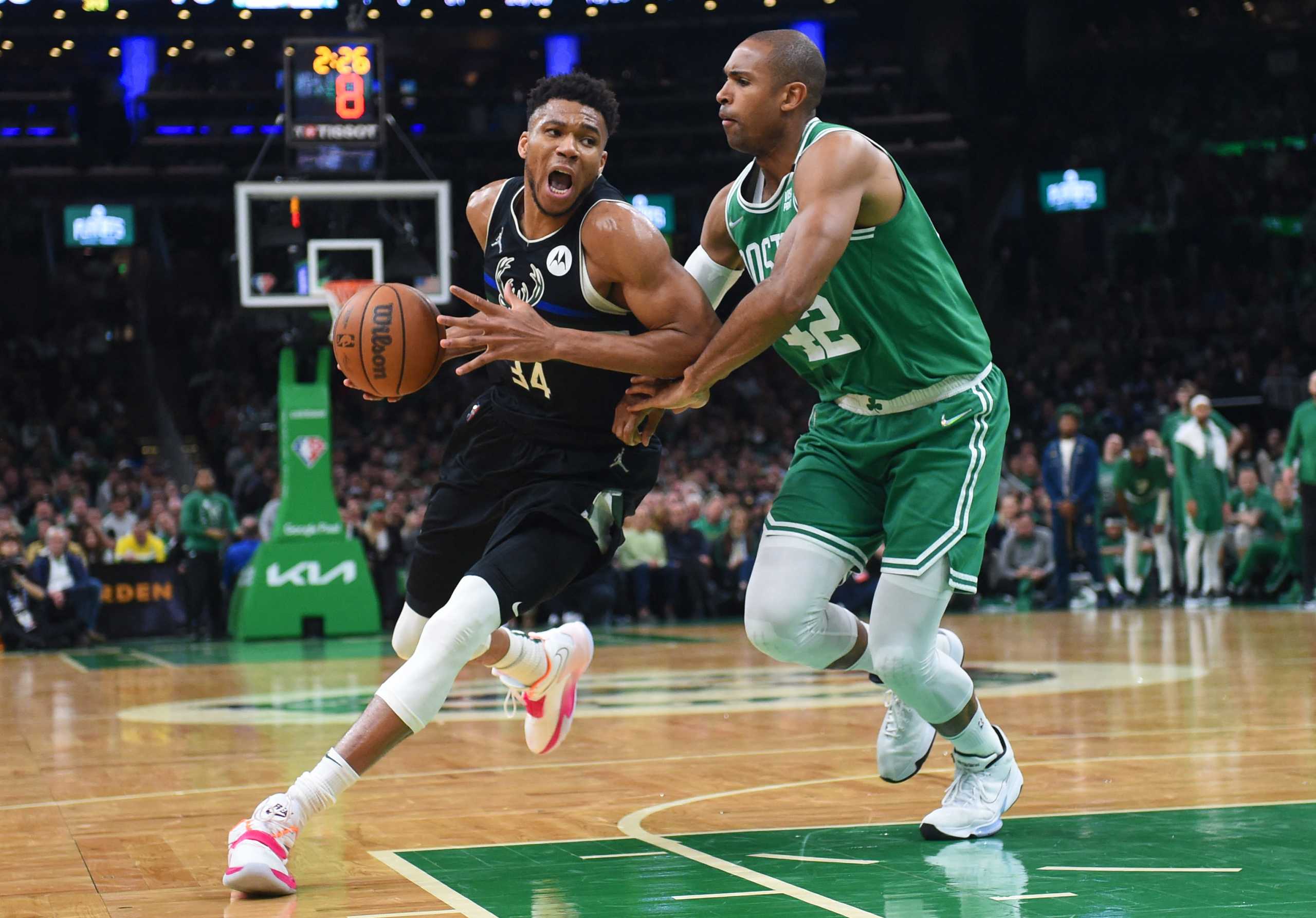 May 3, 2022; Boston, Massachusetts, USA; Milwaukee Bucks forward Giannis Antetokounmpo (34) controls the ball while Boston Celtics center Al Horford (42) defends in the second half during game two of the second round for the 2022 NBA playoffs at TD Garden. Mandatory Credit: Bob DeChiara-USA TODAY Sports