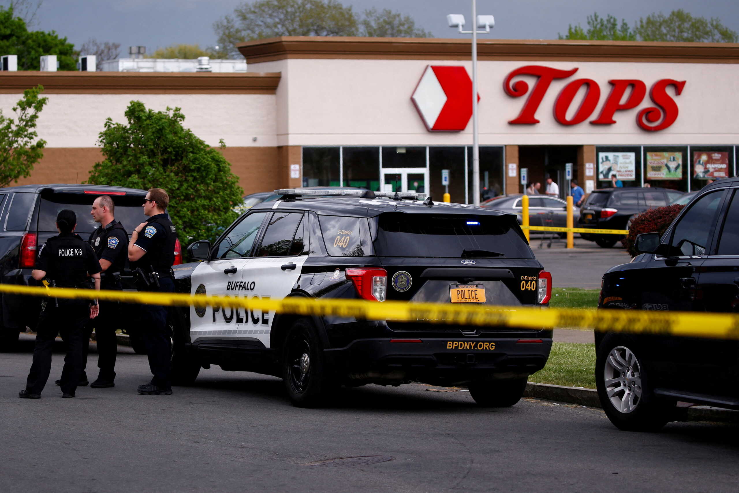 Police officers secure the scene after a shooting at TOPS supermarket in Buffalo, New York, U.S. May 14, 2022.  REUTERS