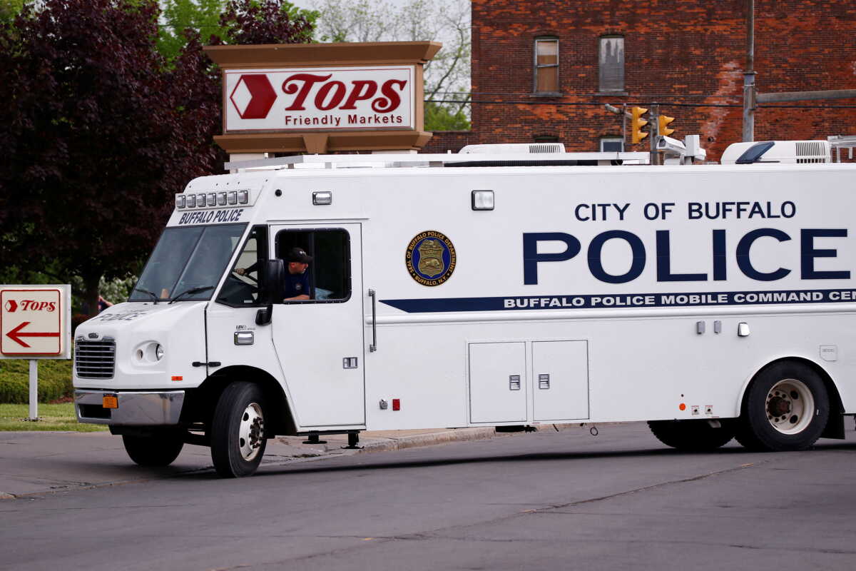 Police officers secure the scene after a shooting at TOPS supermarket in Buffalo, New York, U.S. May 15, 2022.  REUTERS
