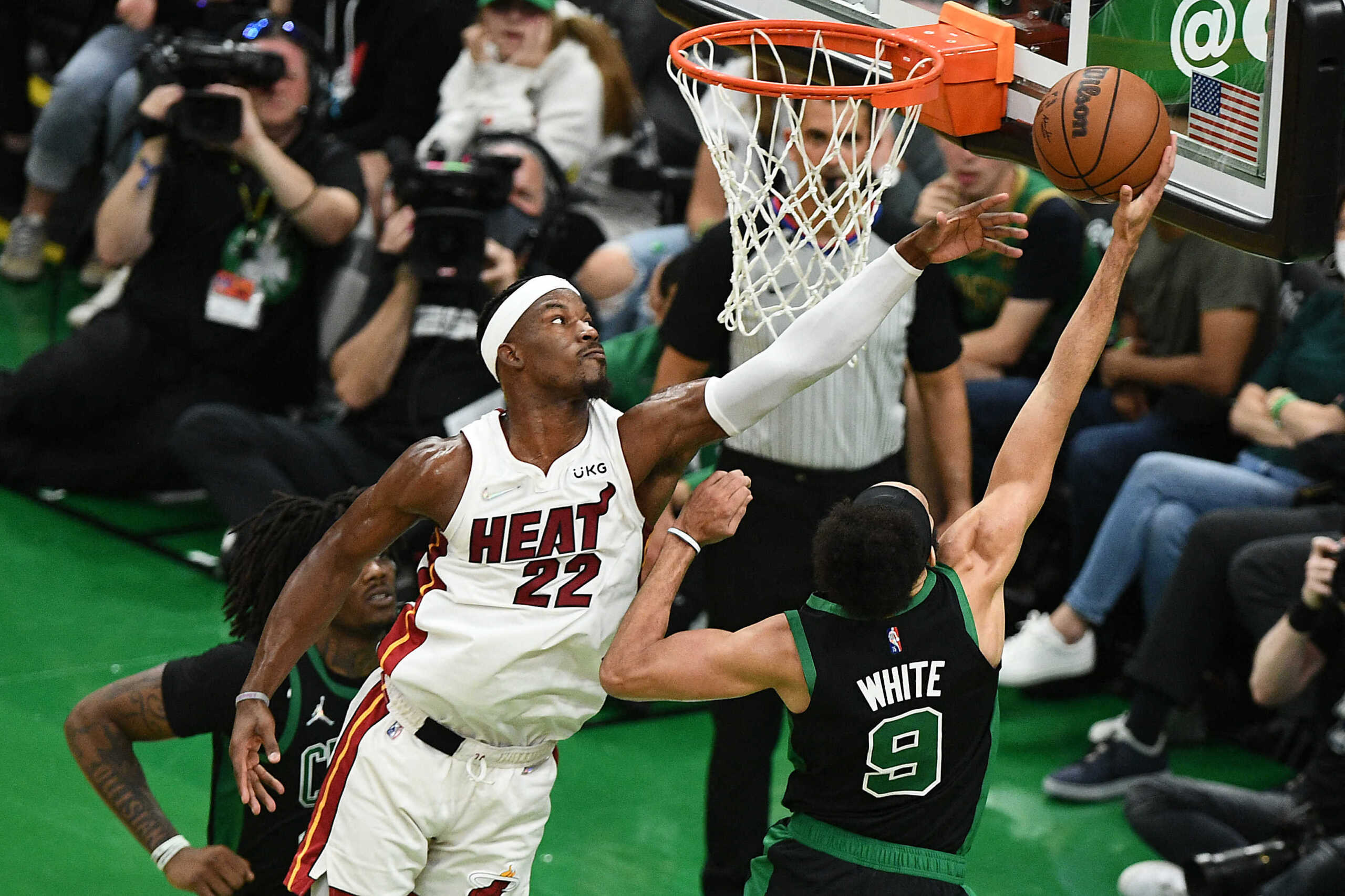 May 27, 2022; Boston, Massachusetts, USA; Miami Heat forward Jimmy Butler (22) moves to the basket against Boston Celtics guard Derrick White (9) during the first half in game six of the 2022 eastern conference finals at TD Garden. Mandatory Credit: Brian Fluharty-USA TODAY Sports