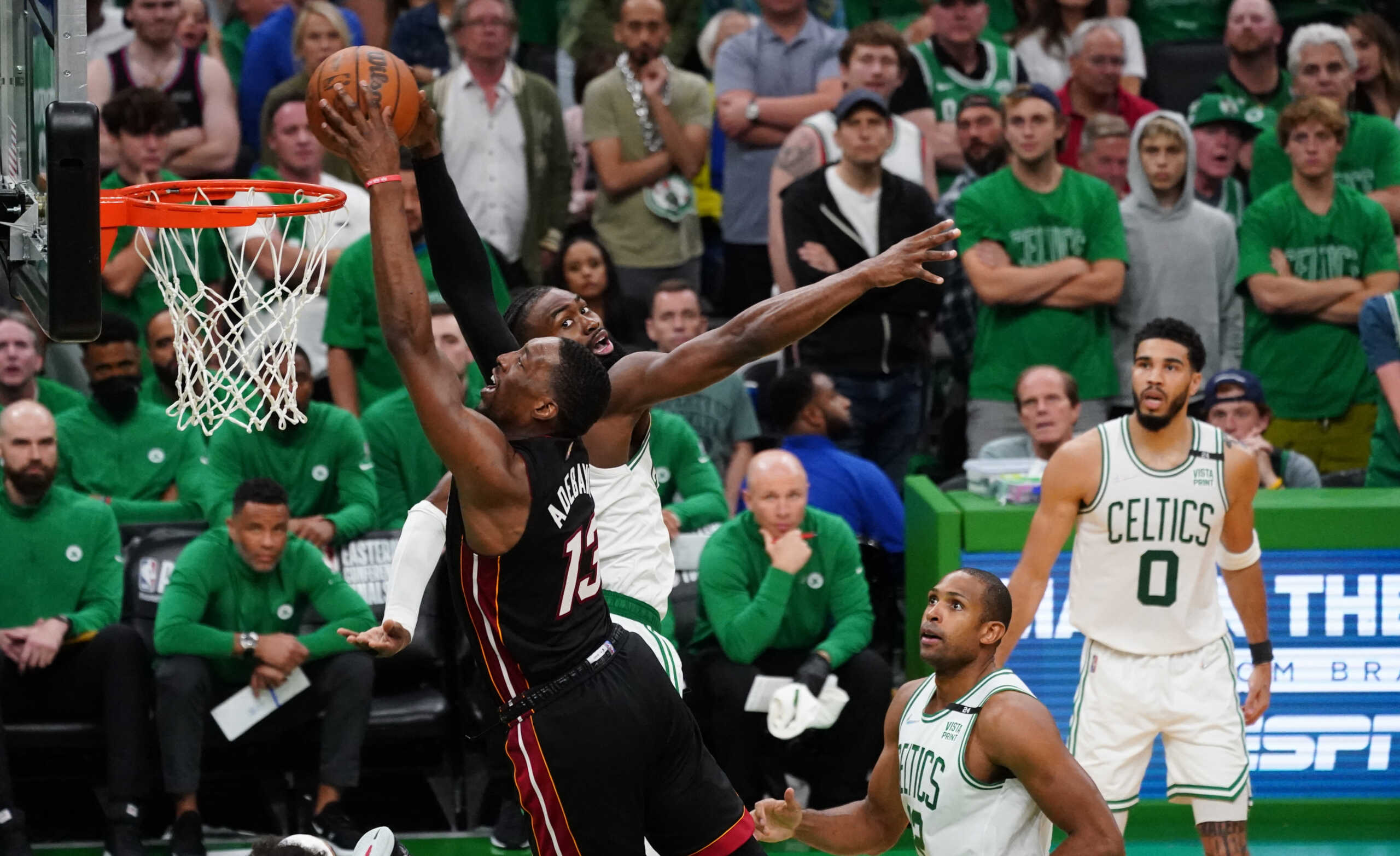 May 21, 2022; Boston, Massachusetts, USA; Miami Heat center Bam Adebayo (13) drives to the basket against Boston Celtics guard Jaylen Brown (7) in the fourth quarter during game three of the 2022 eastern conference finals at TD Garden. Mandatory Credit: David Butler II-USA TODAY Sports
