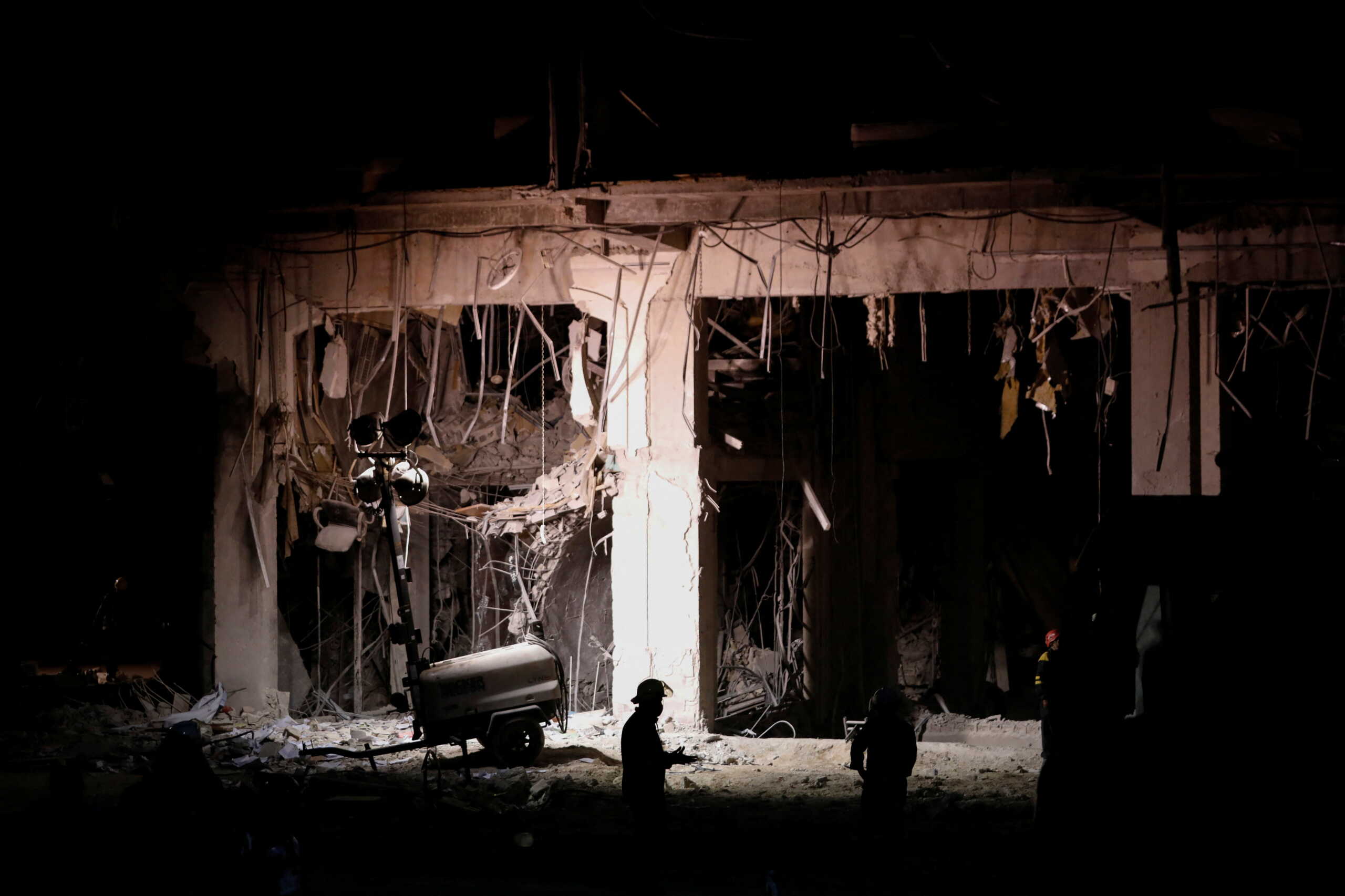 Emergency personnel walks in front of the Saratoga Hotel two days after it suffered an explosion, in Havana, Cuba May 8, 2022. REUTERS