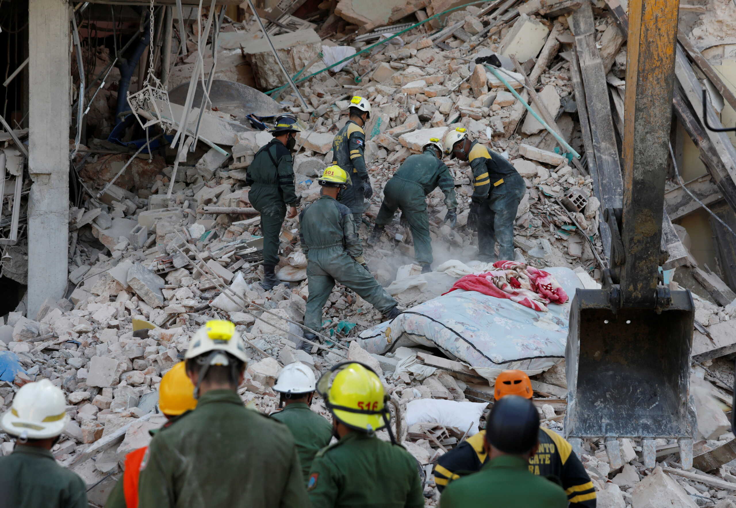 Emergency personnel work at the Saratoga Hotel a day after it suffered an explosion, in Havana, Cuba May 7, 2022. REUTERS