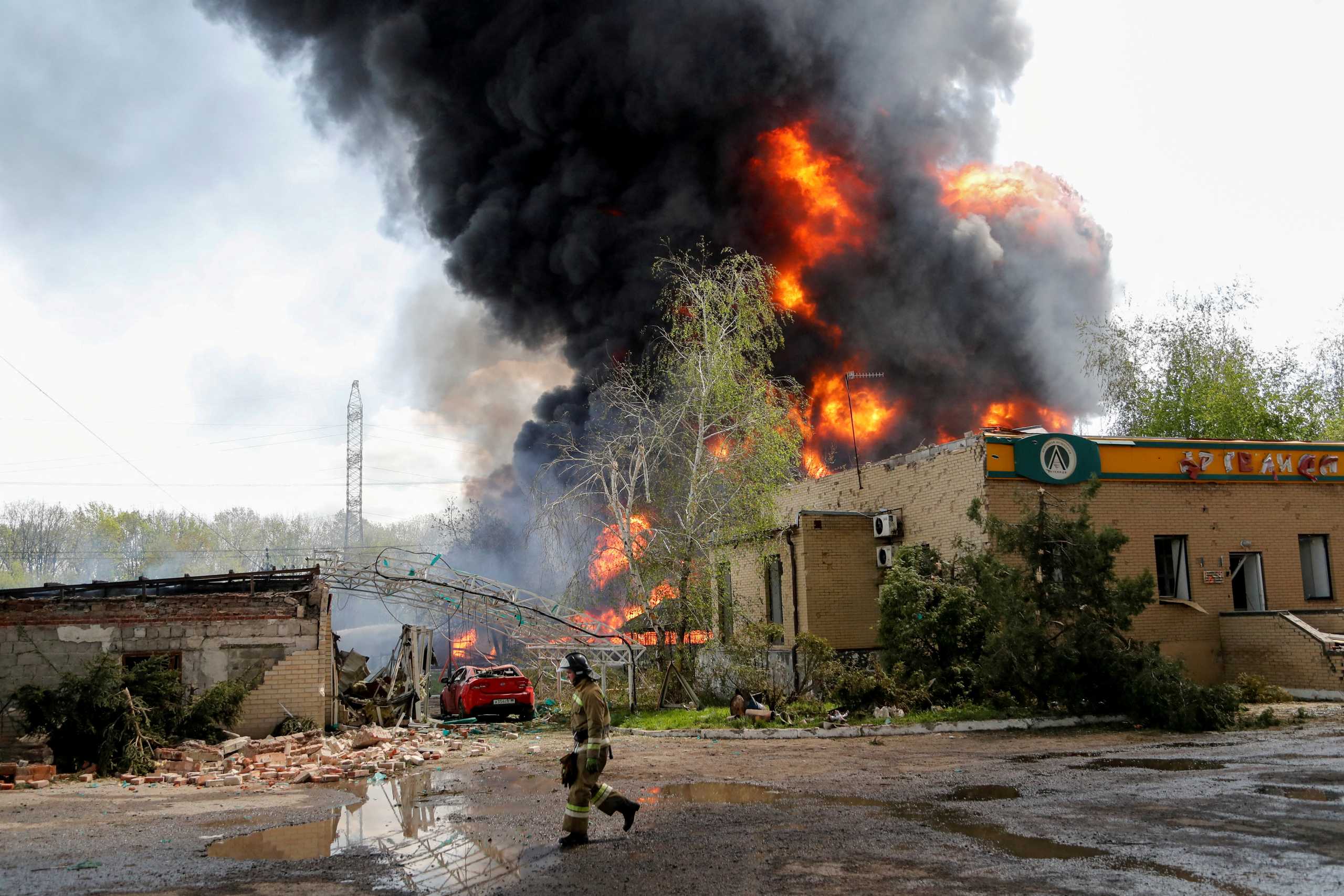 Smoke rises above a burning oil storage in the course of Ukraine-Russia conflict on the outskirts of Donetsk, Ukraine May 4, 2022. REUTERS