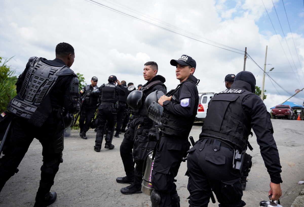 Police officers stand guard outside the Santo Domingo de los Tsachilas prison after Ecuadorean authorities reported that they managed to put out a riot and recapture several inmates that had escaped, in Santo Domingo, Ecuador May 9, 2022. REUTERS