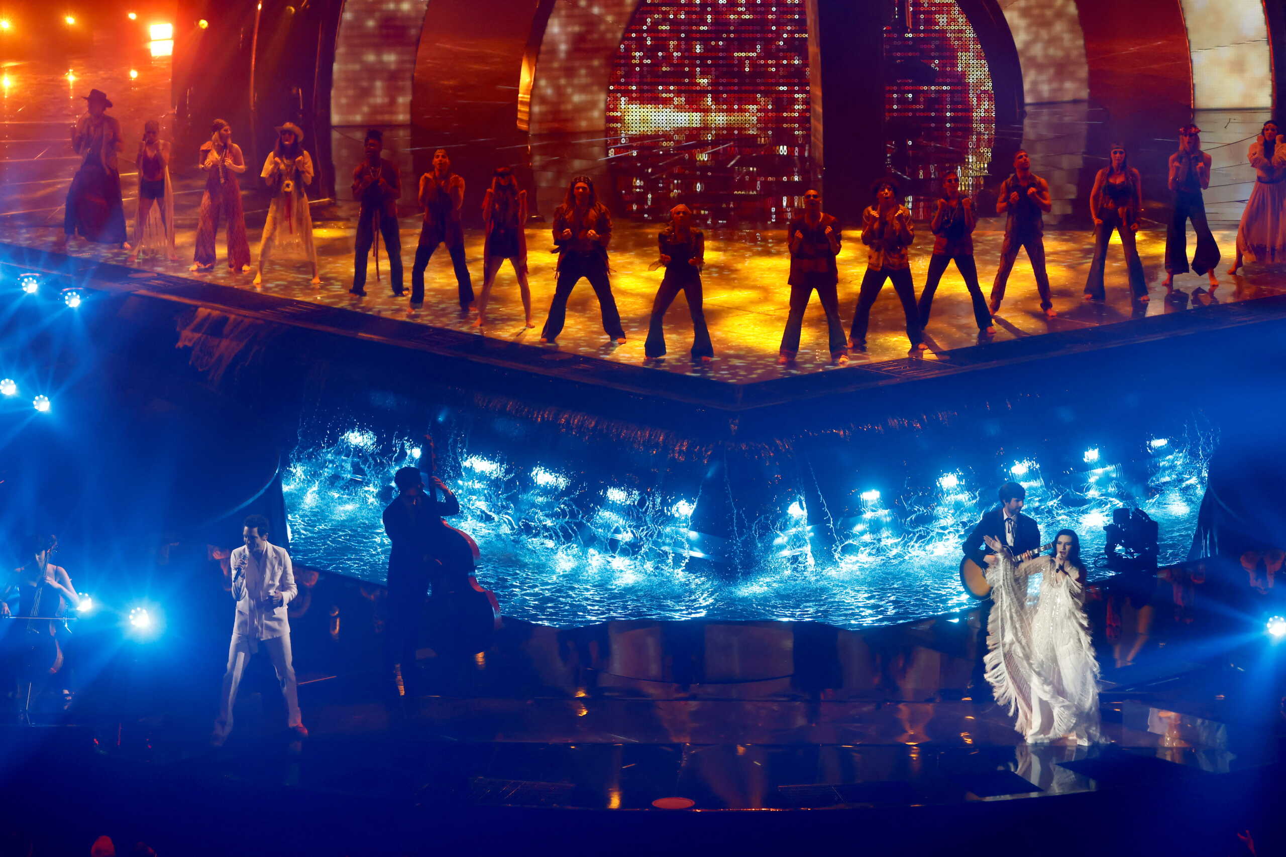 Hosts Laura Pausini and Mika perform during the second semi-final of the 2022 Eurovision Song Contest in Turin, Italy May 12, 2022. REUTERS
