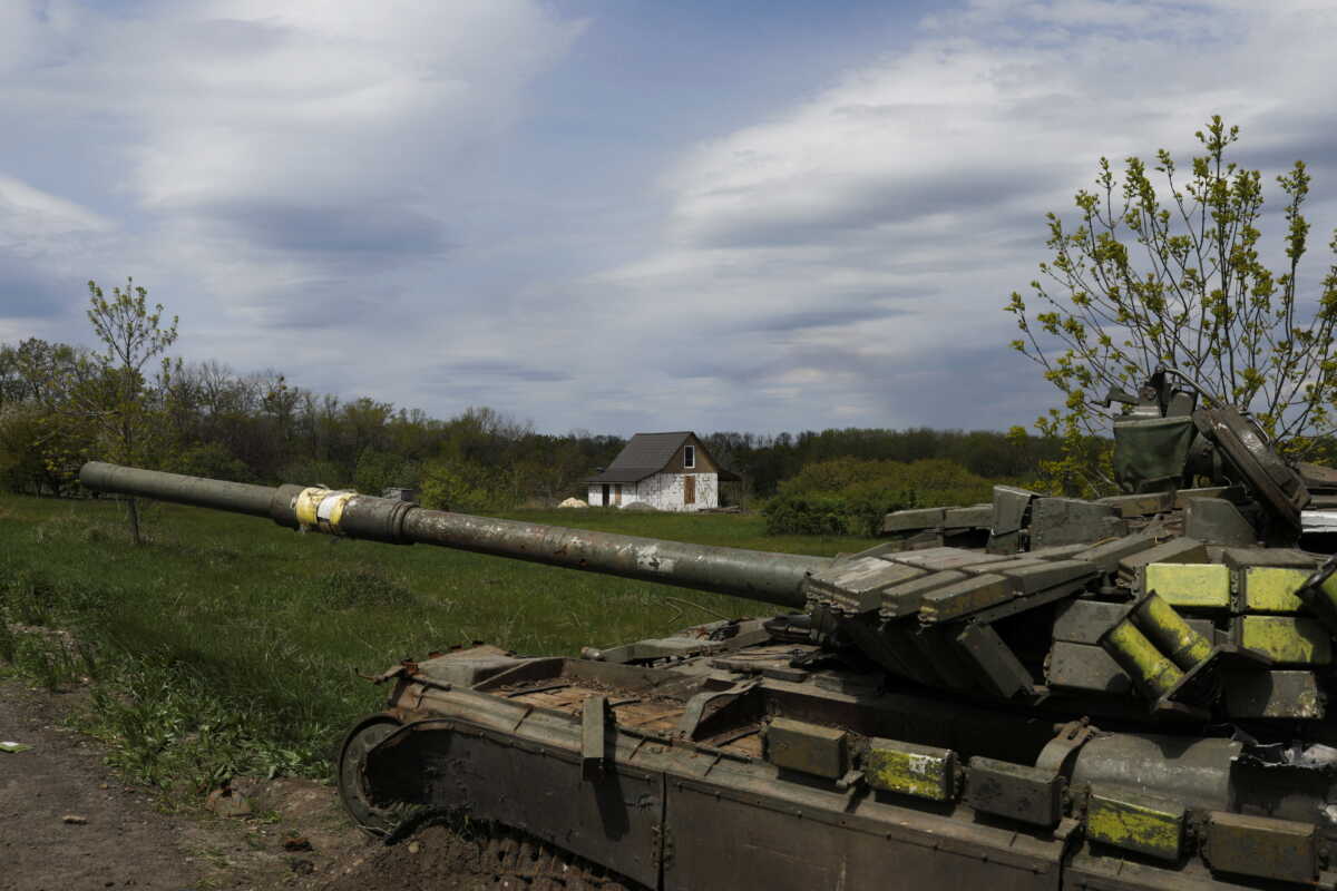 A view shows a house next to a damaged Ukrainian tank in Vilhivka village, amid Russia's attack on Ukraine, near Kharkiv, Ukraine, May 11, 2022. REUTERS